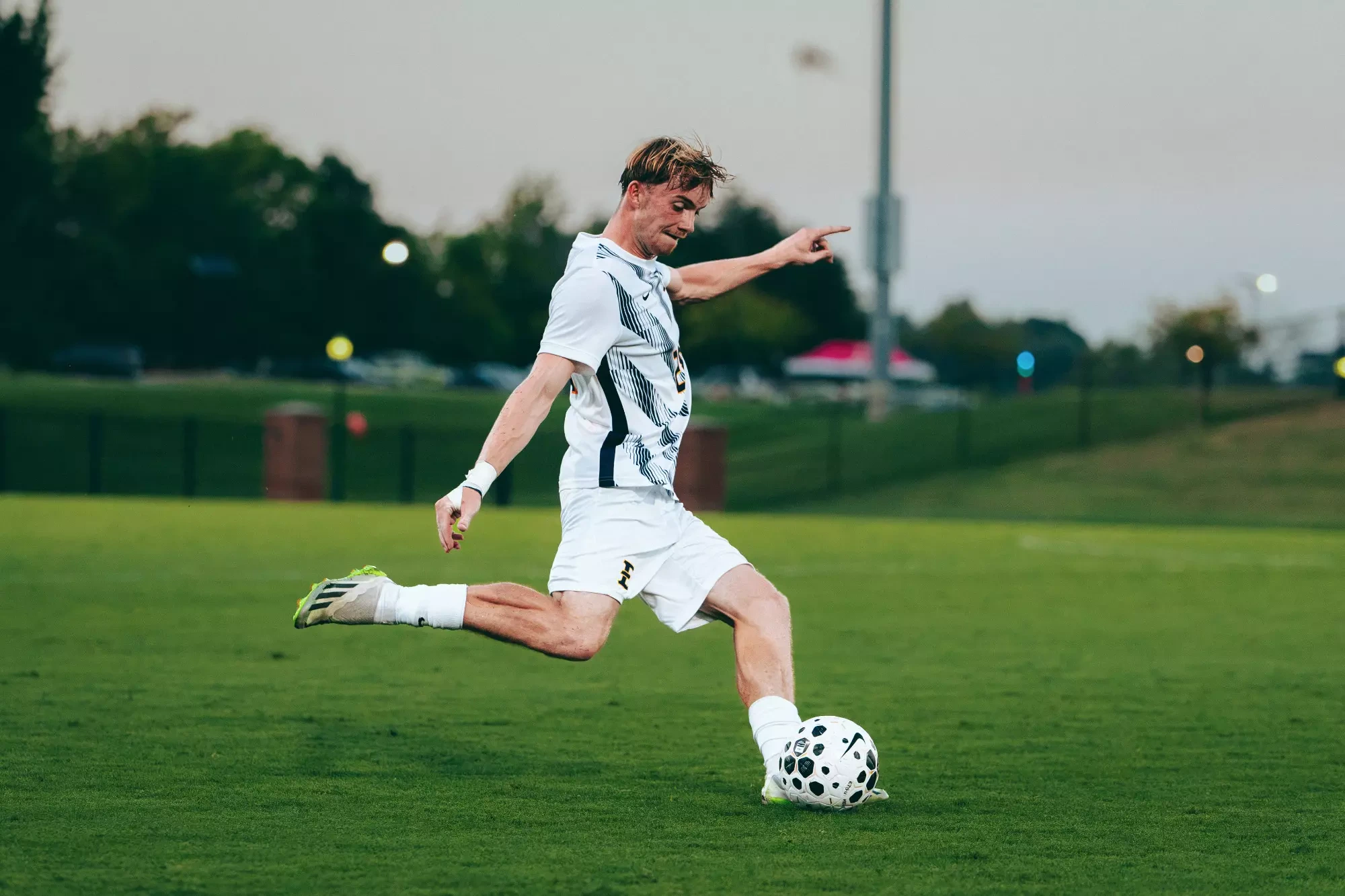 Elliot Edwards plants his left foot as he prepares to swing his right foot through the ball on a free kick during a soccer match against USC Upstate.
