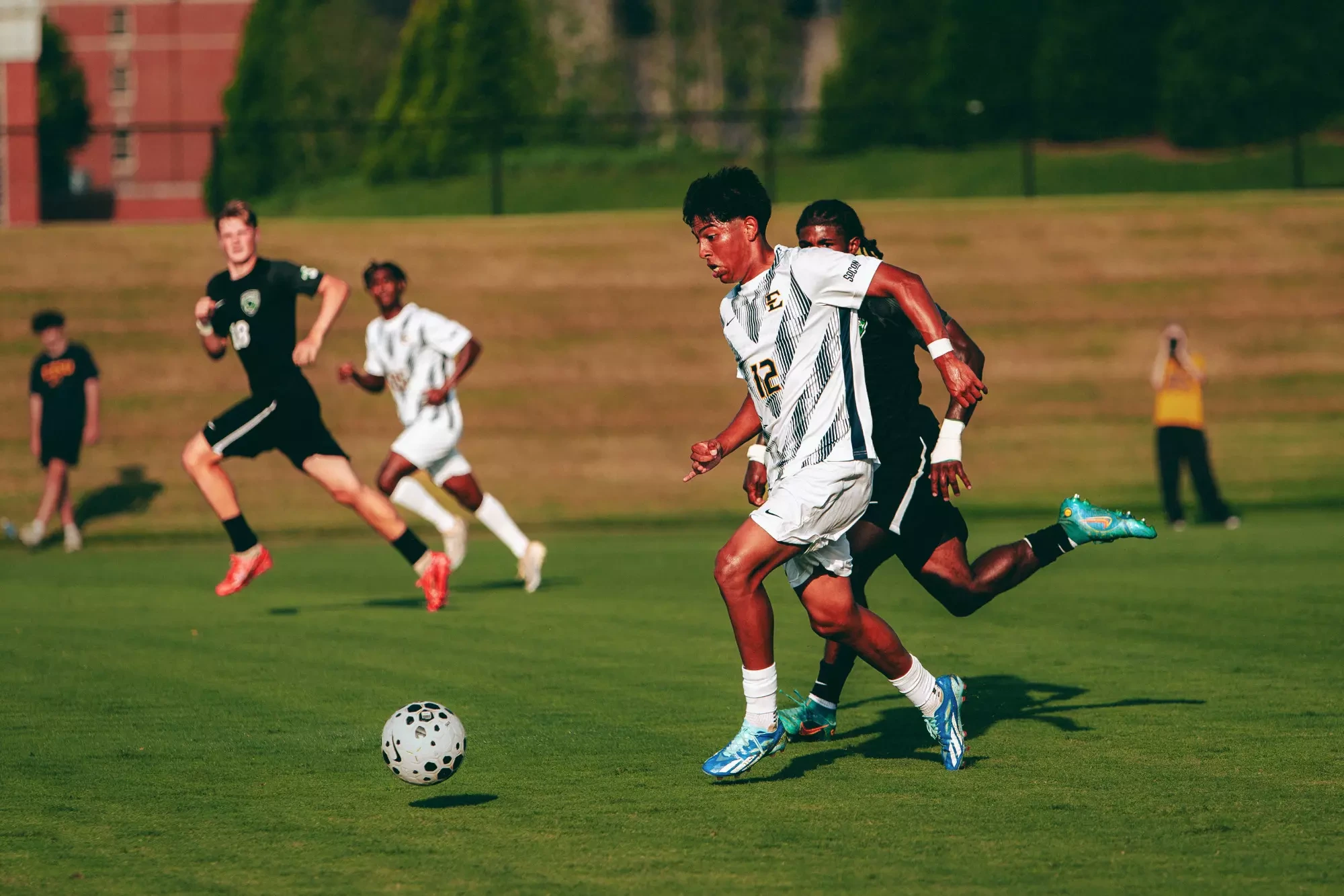 Joe Gonzalez dribbles around a defender during a soccer match against USC Upstate.