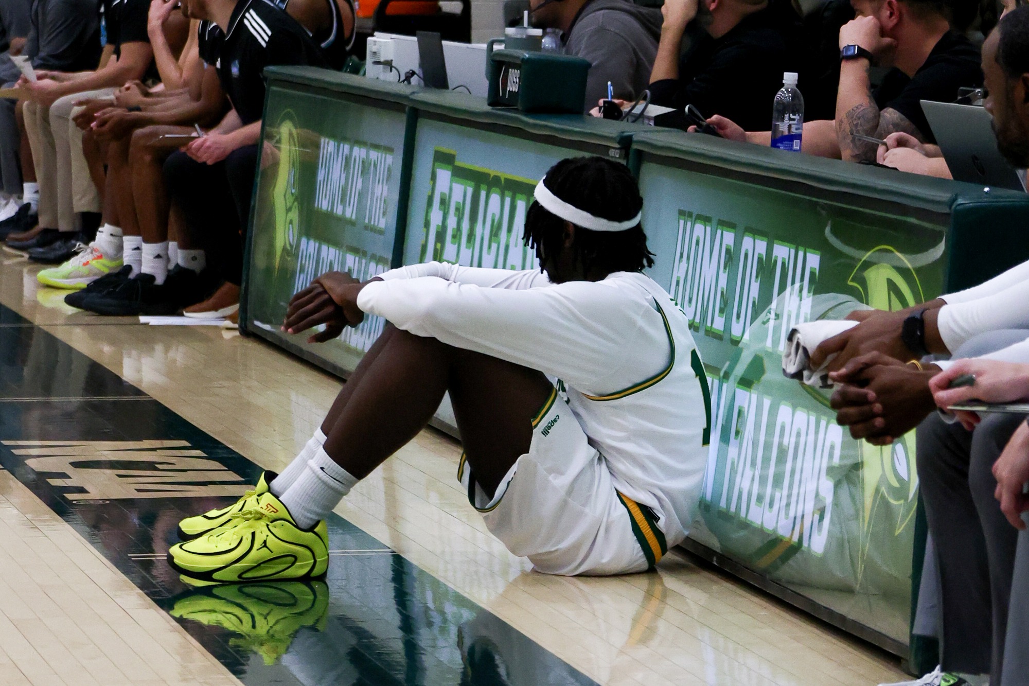 Moussa Camara waits at the scorer’s table to check into the game.