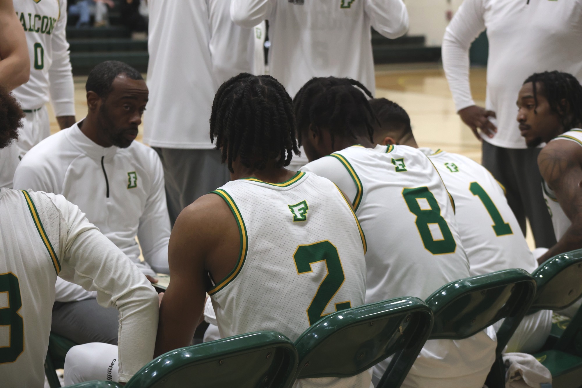 Felician player on the bench during a full time out