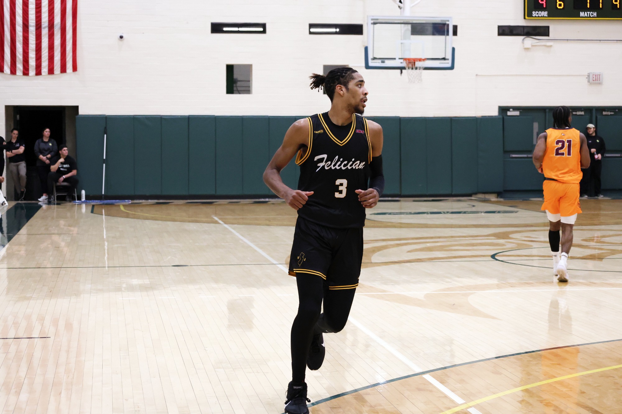 Tavian Pullock runs on the court.