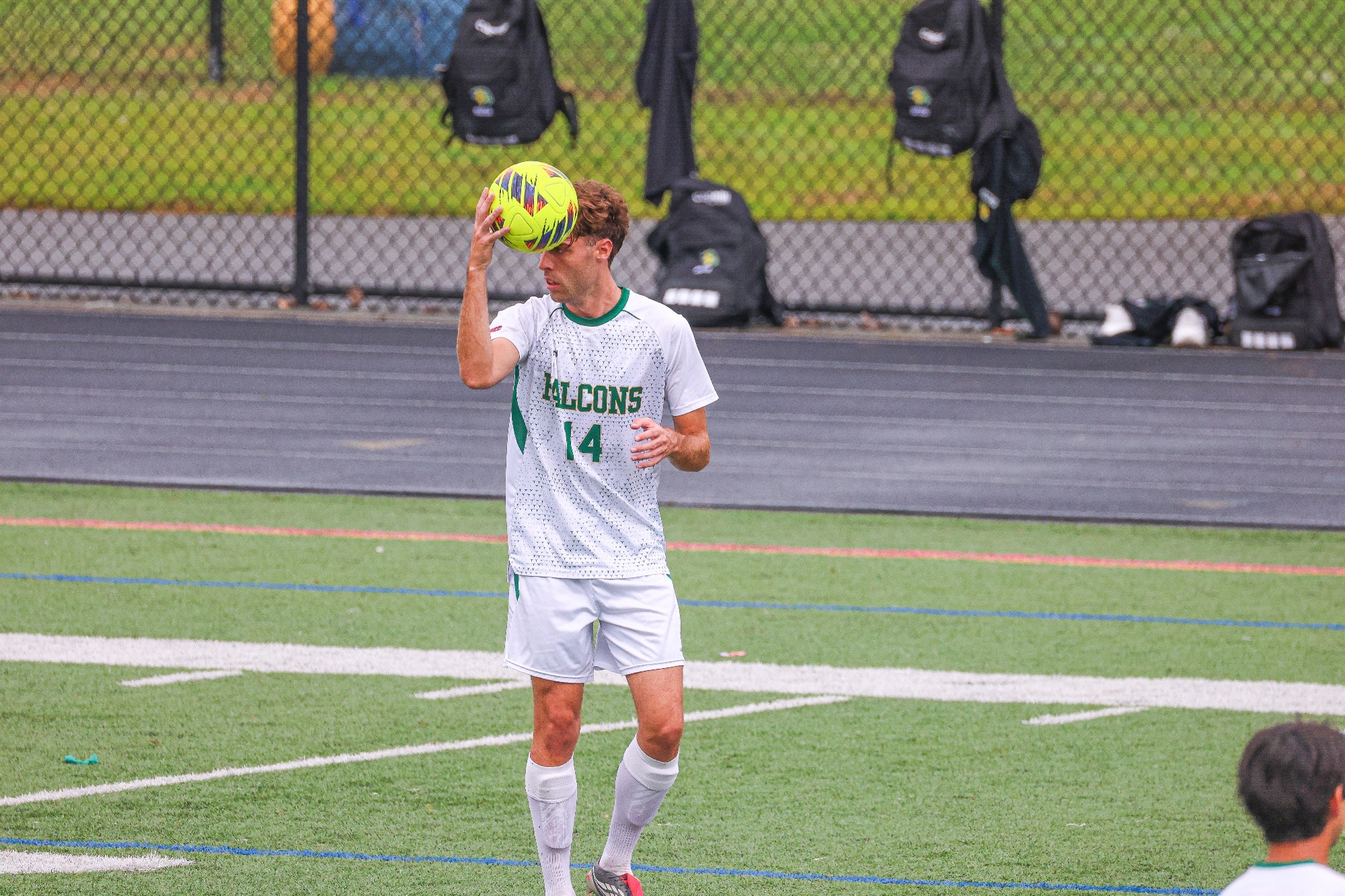 Diego Martin holding soccer ball.