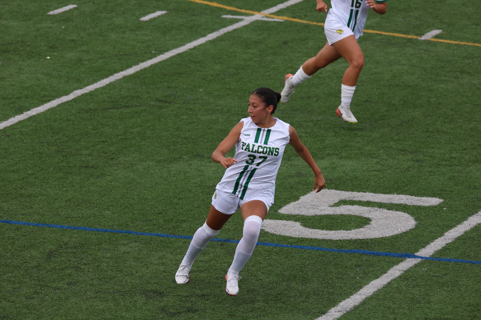 Andrea Melchor Defending on Field