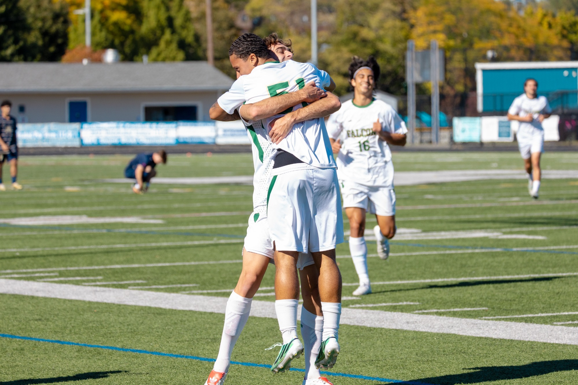Martin and Stepney hugging following Stepney's first collegiate goal.