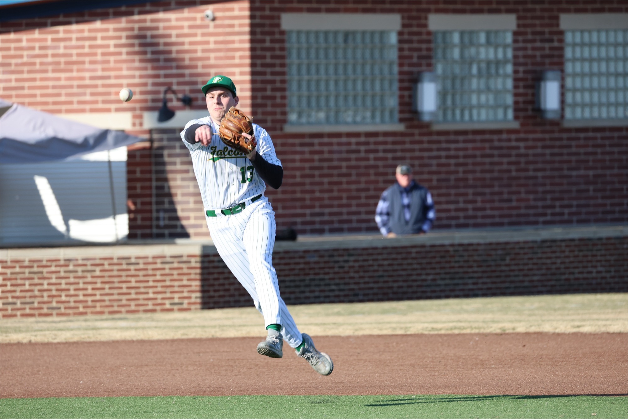 Matthew Scrivanic throws the ball to first base.