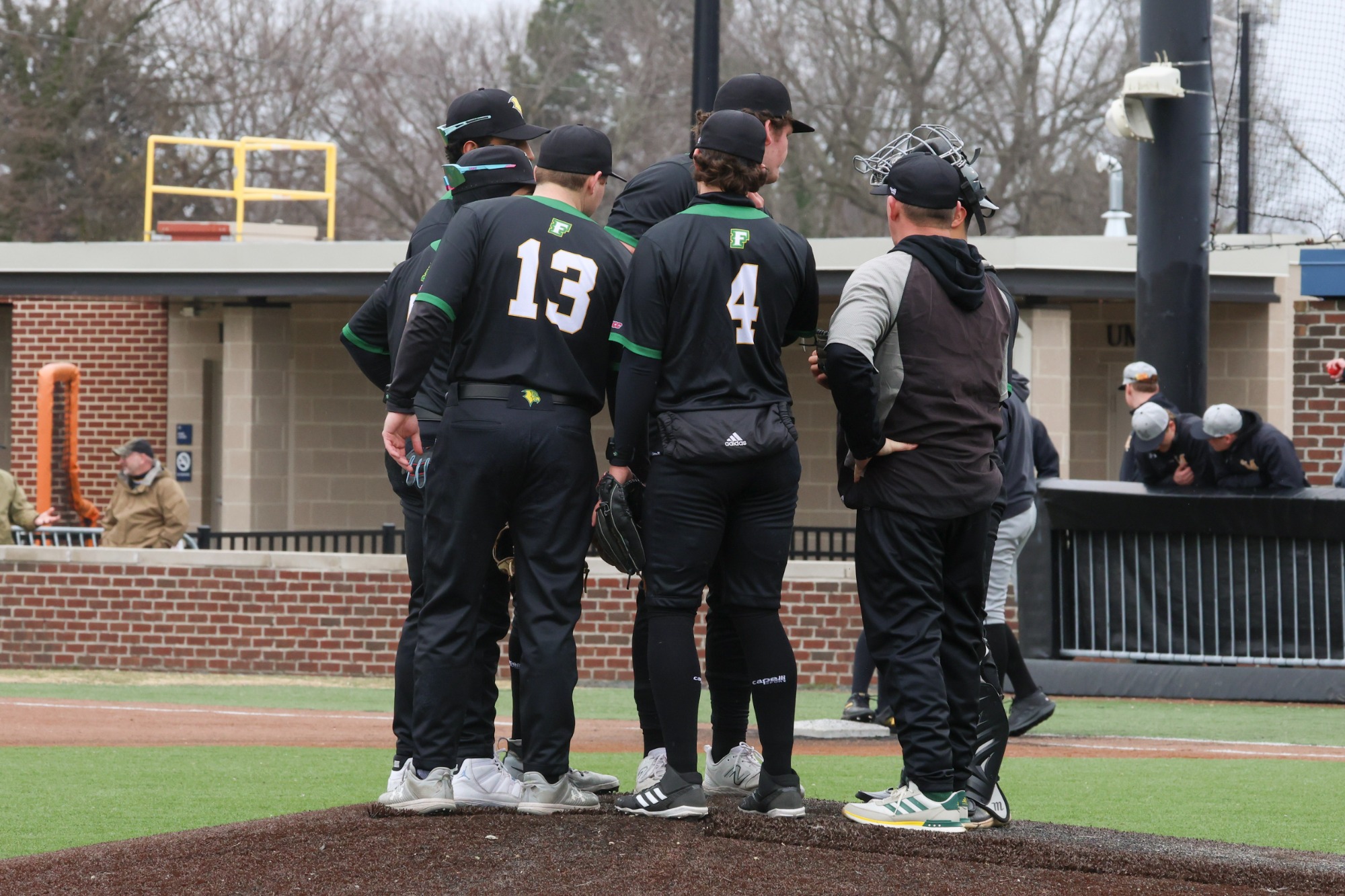 Team huddle on the mound.