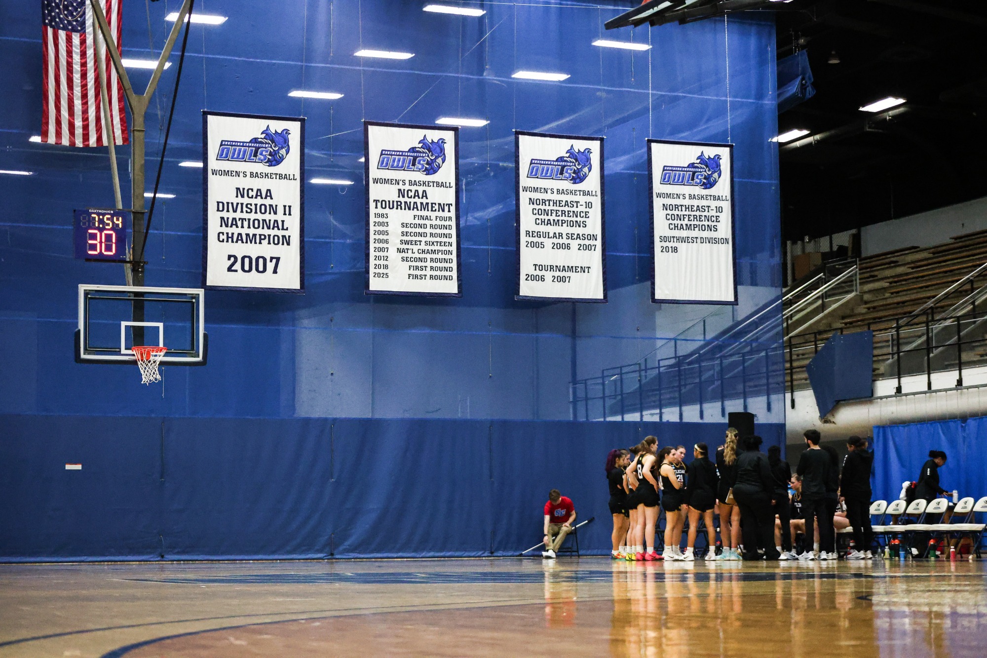 Women's Basketball Team in huddle at NCAA Regionals 