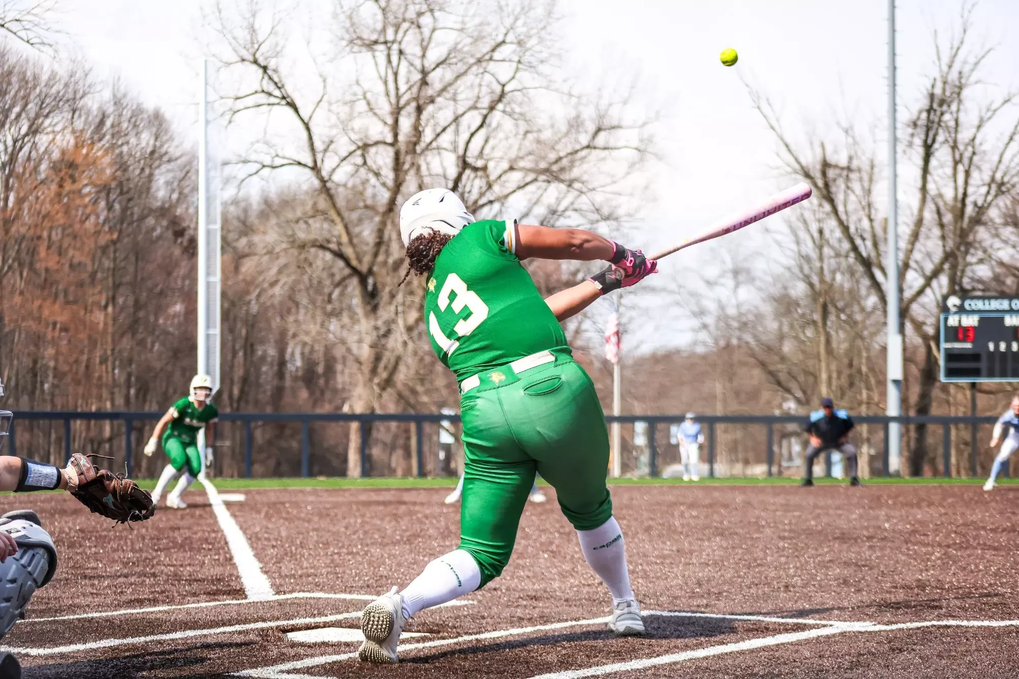 Kim Torres launches a home run to left field.