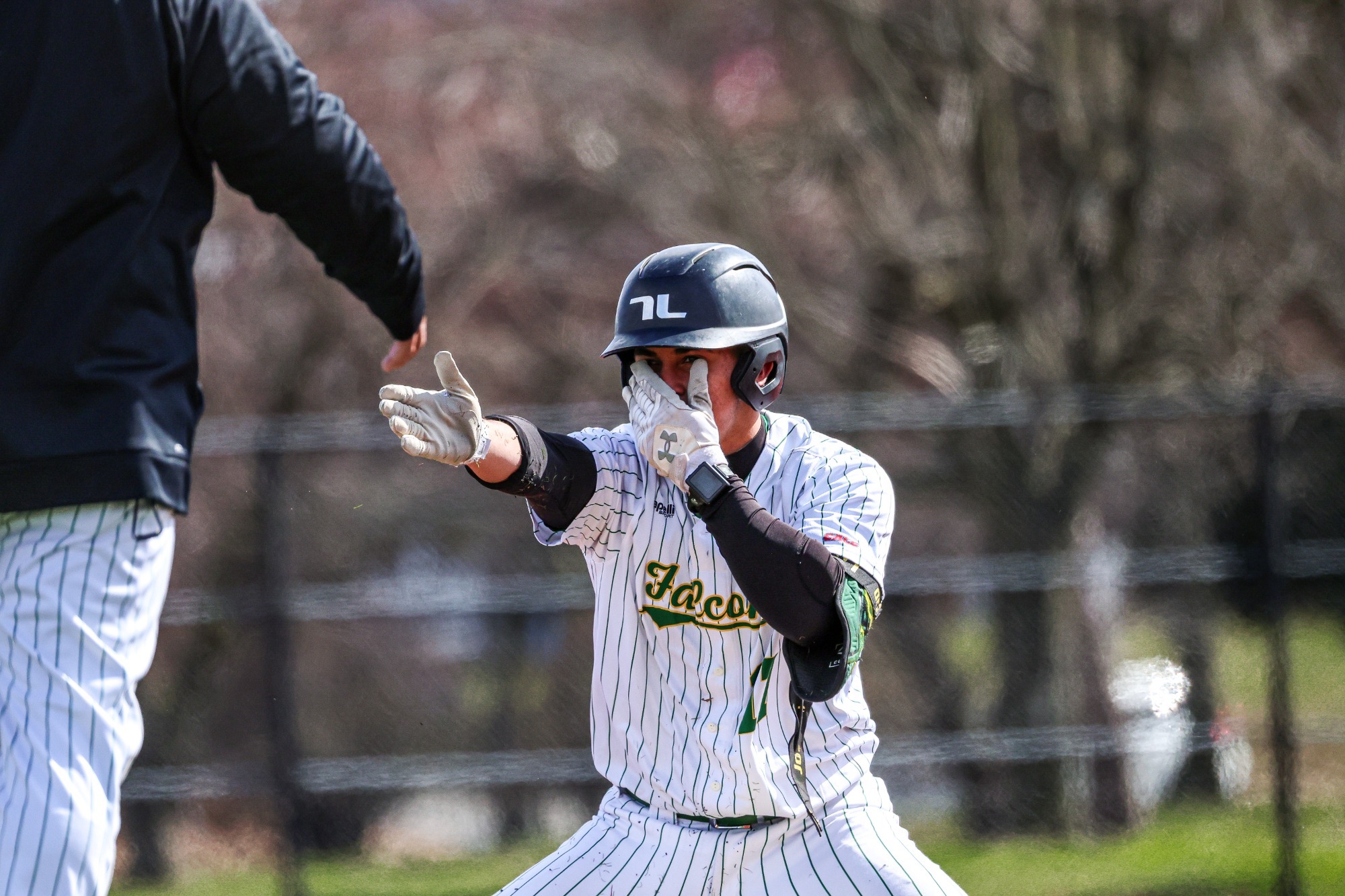 Jose David Medrano celebrates after recording a triple.