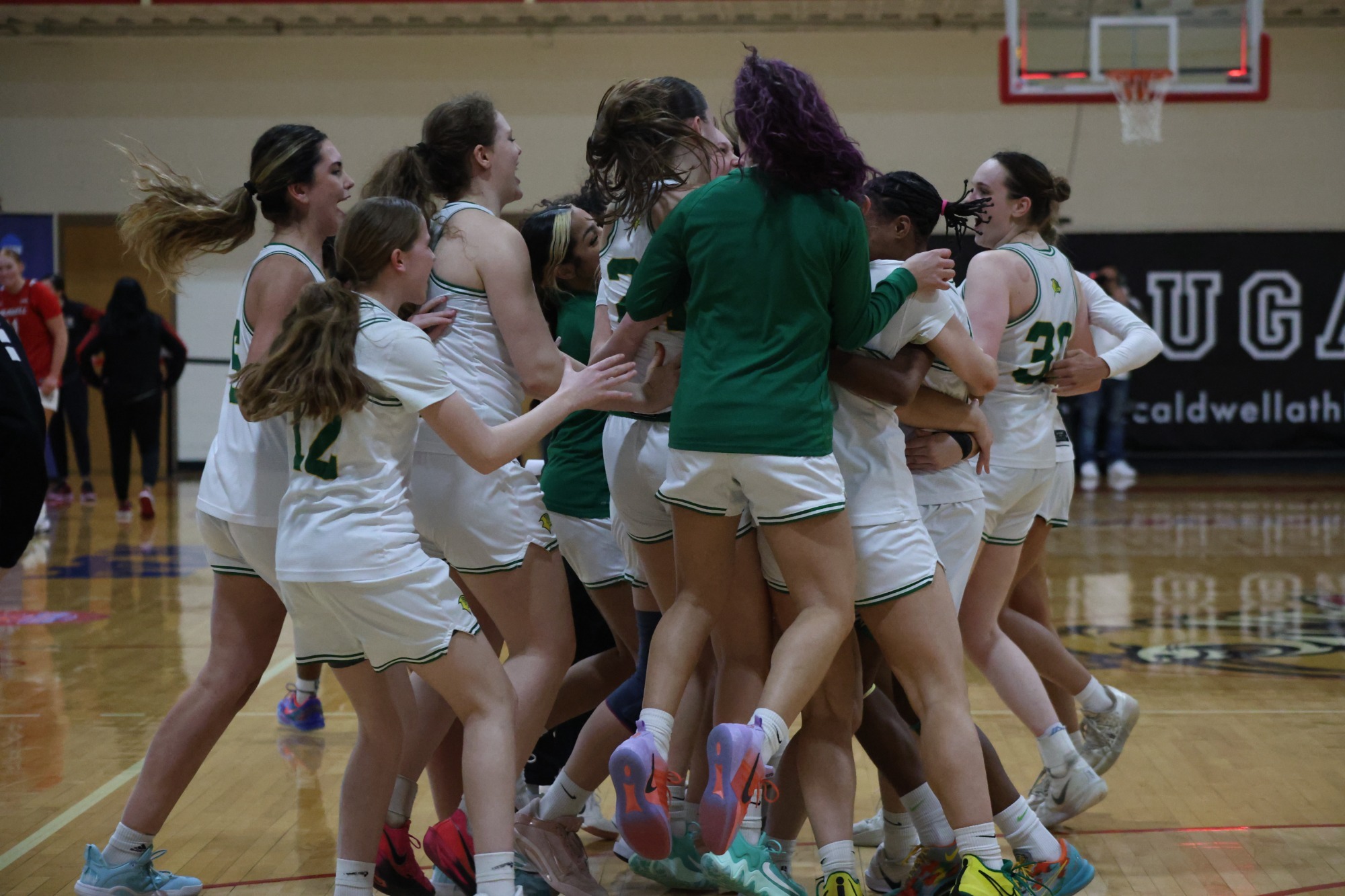 Women's Basketball celebrating win over Caldwell as they advance to the CACC Championship 
