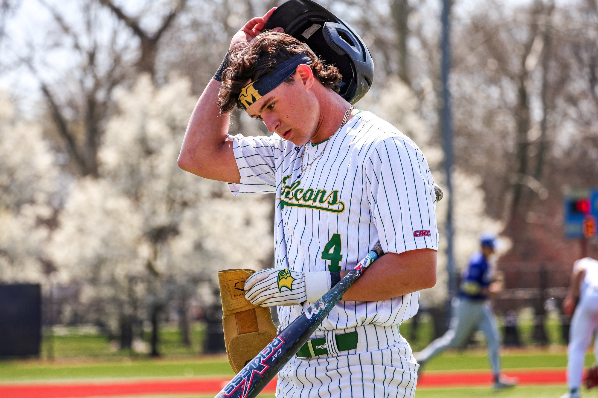 Haiden Walters returns to the dugout after the final out of the inning.