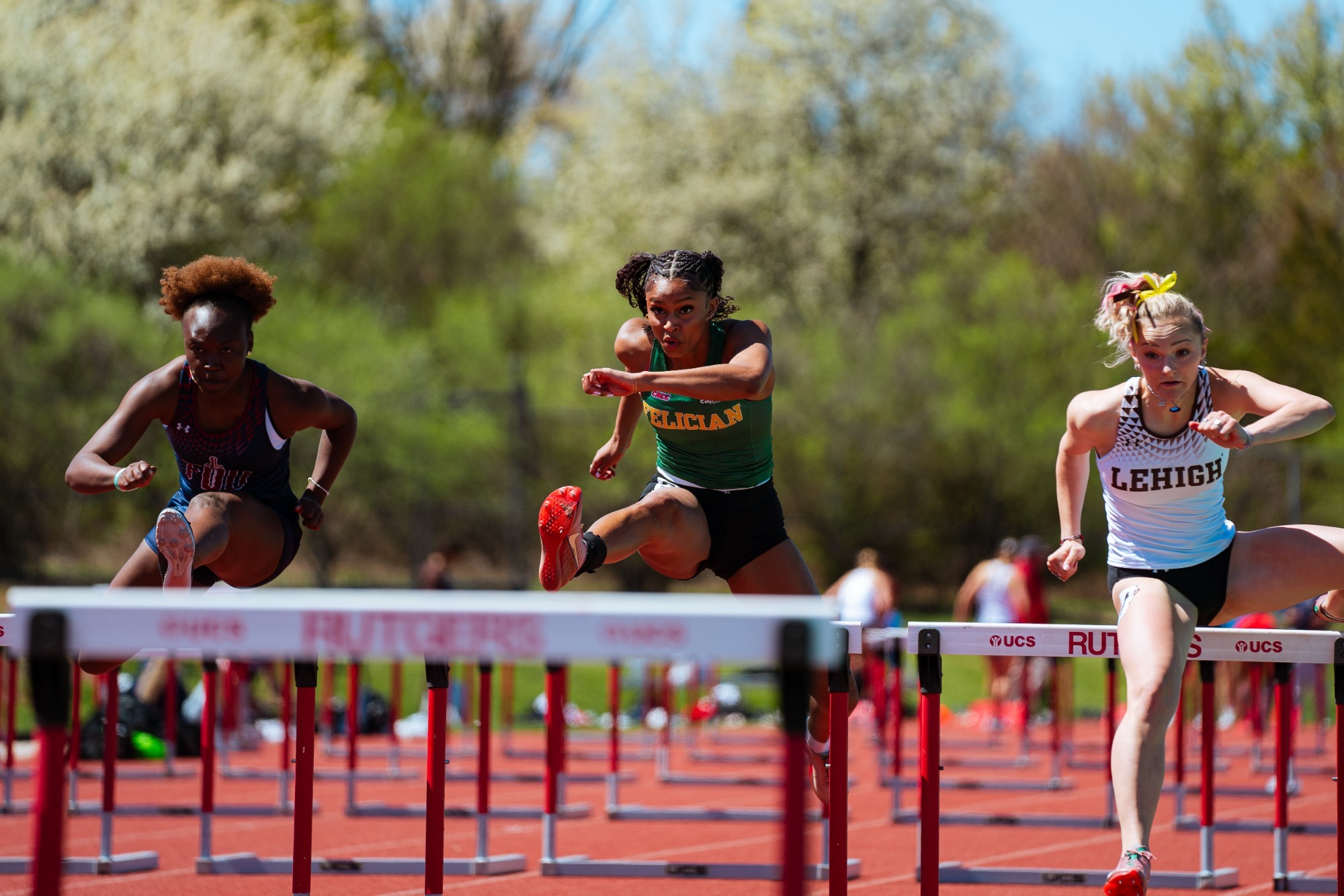 Aarysa Moore jumping over hurdles