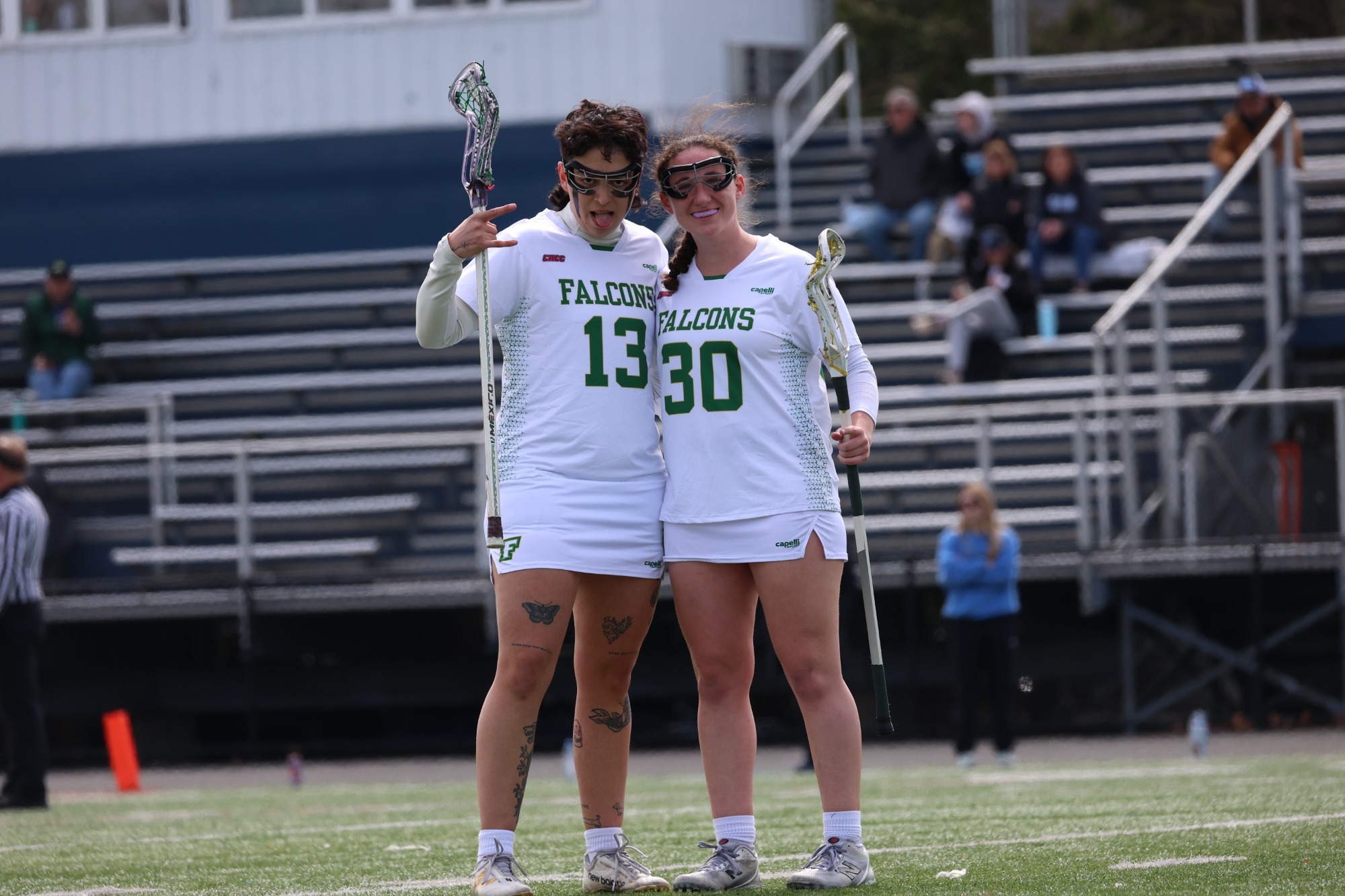 Natalia Ogando and Madison Cancela posing for a mid game photo