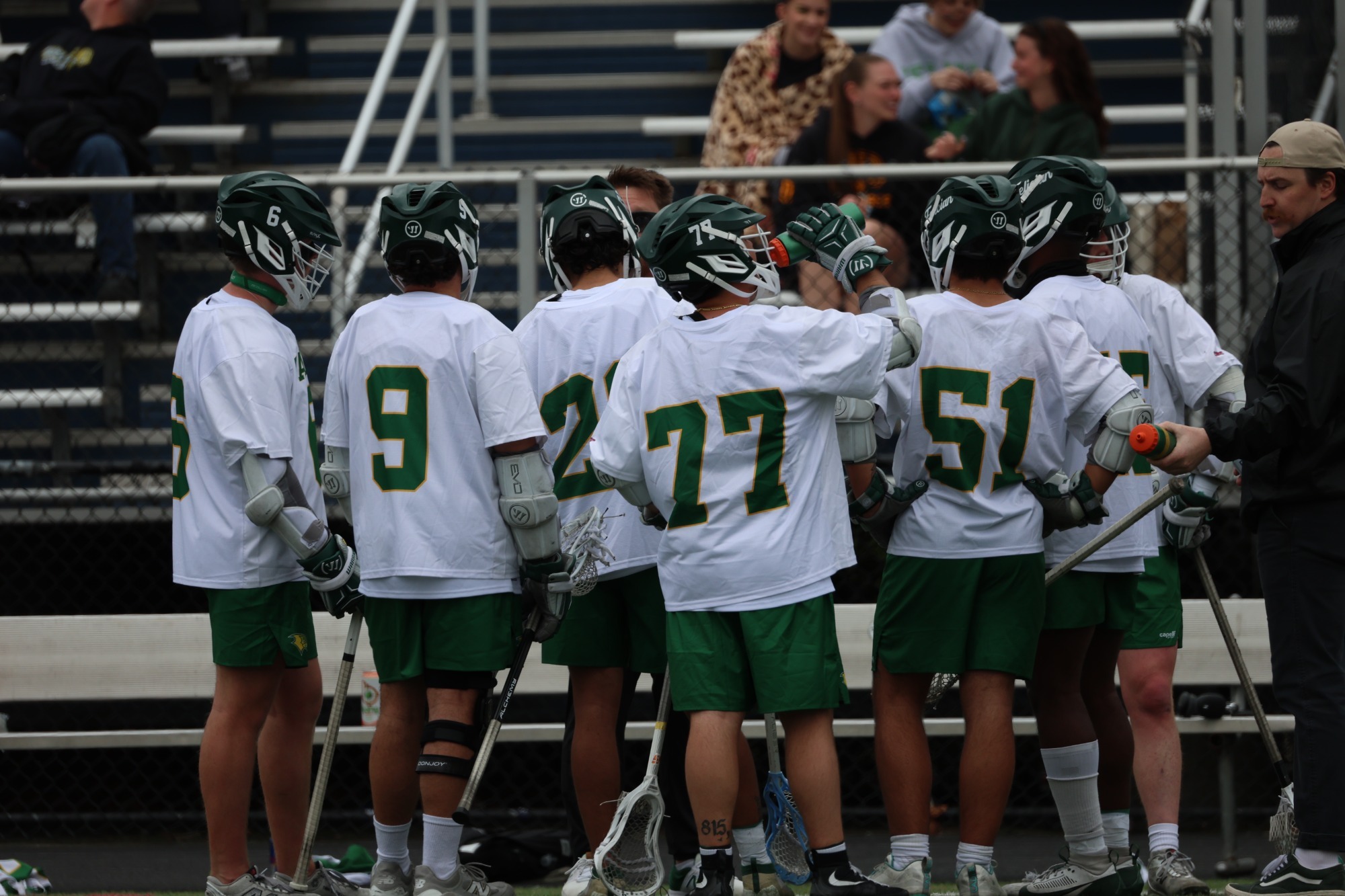 Men's Lacrosse team huddle