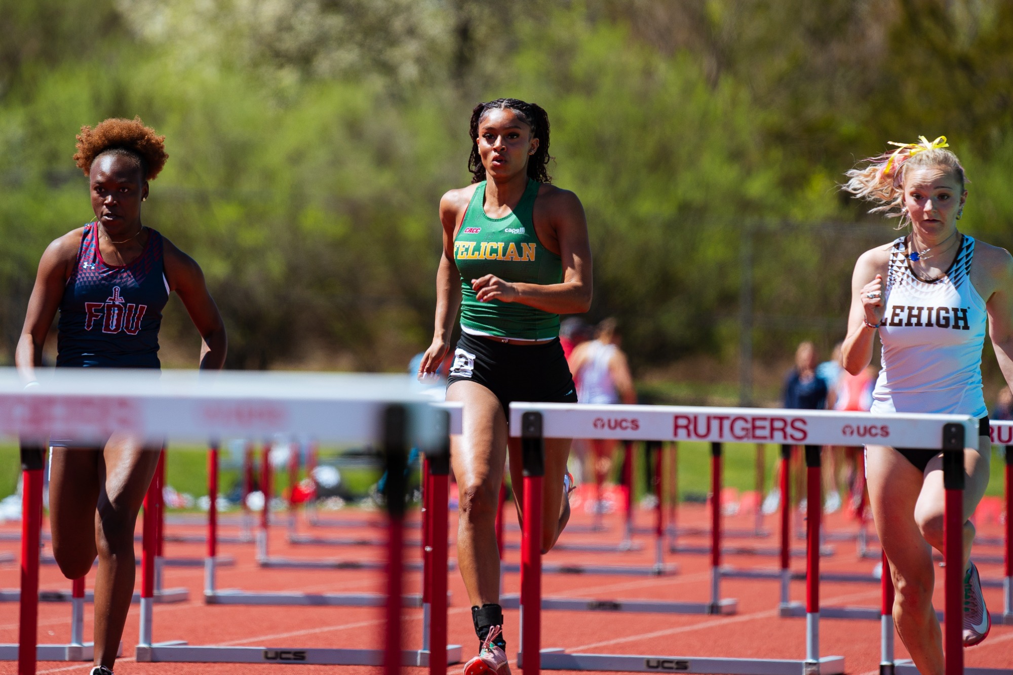 Women's Track and Field Aarysa Moore in hurdles