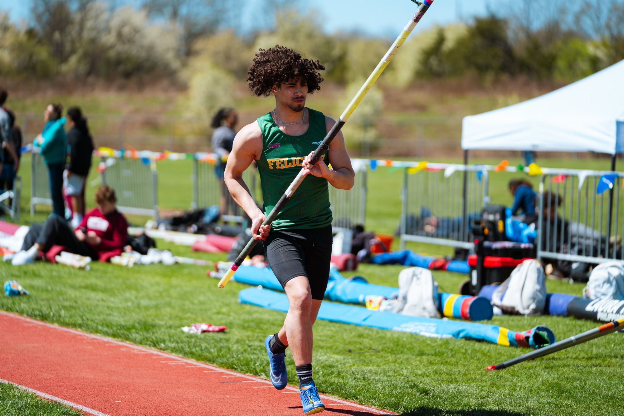 Gaston running in the pole vault