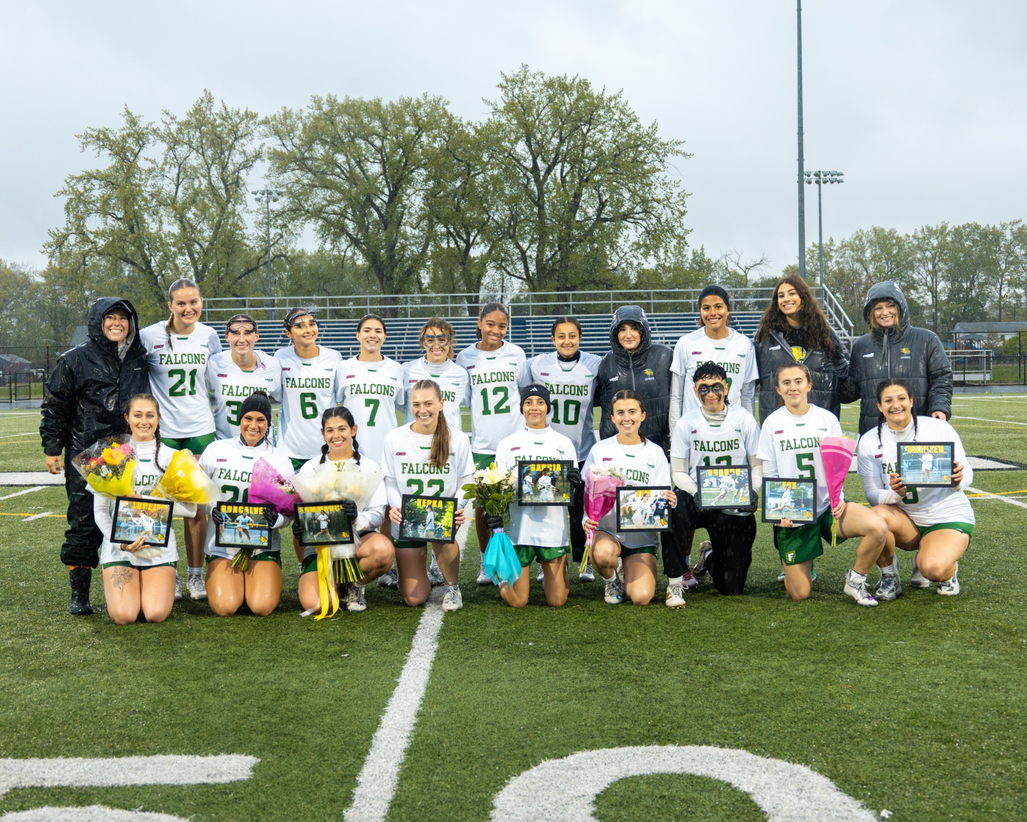 Women's Lacrosse honroing their nine seniors on senior night