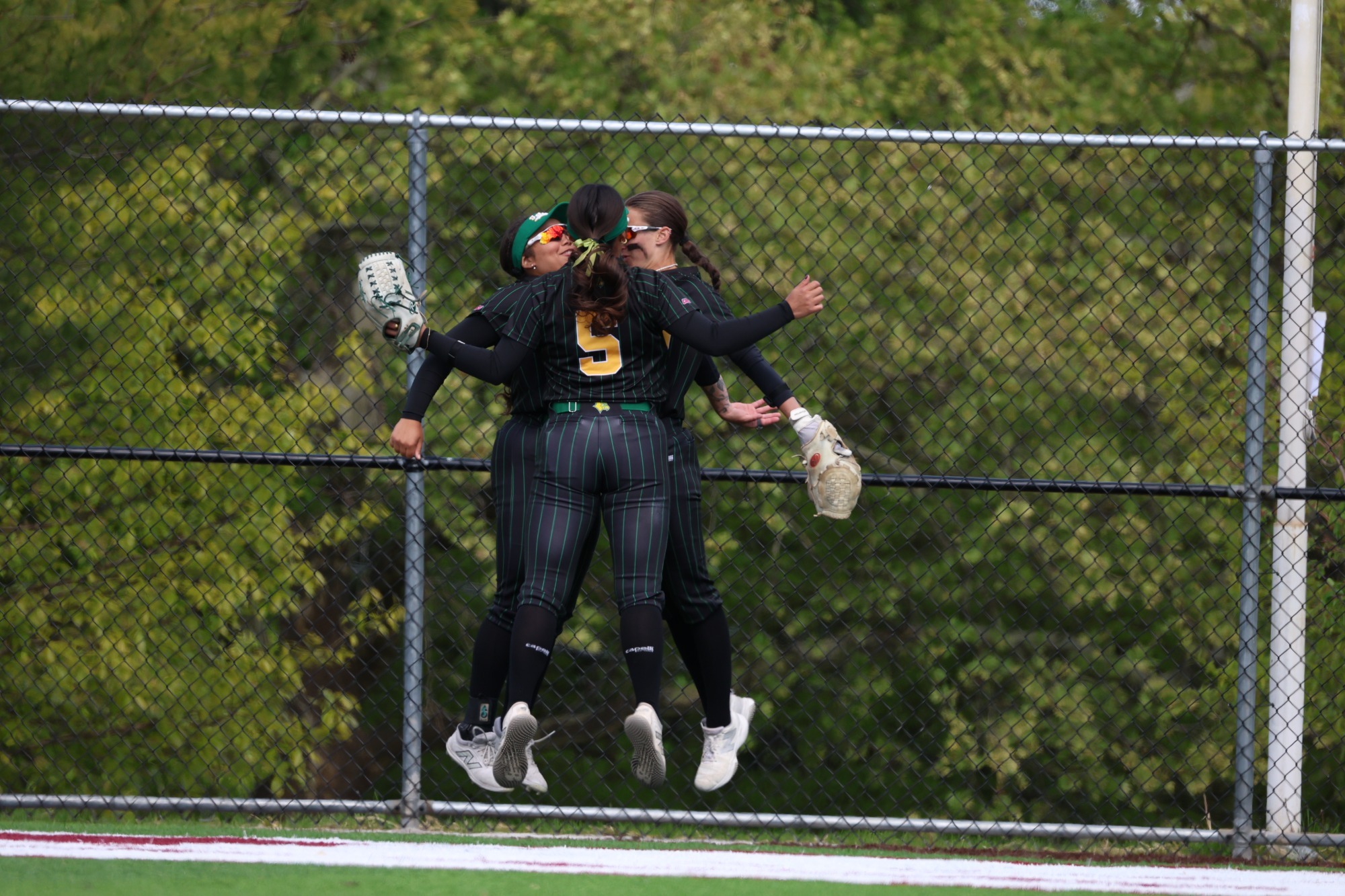 Outfield celebrates an out.