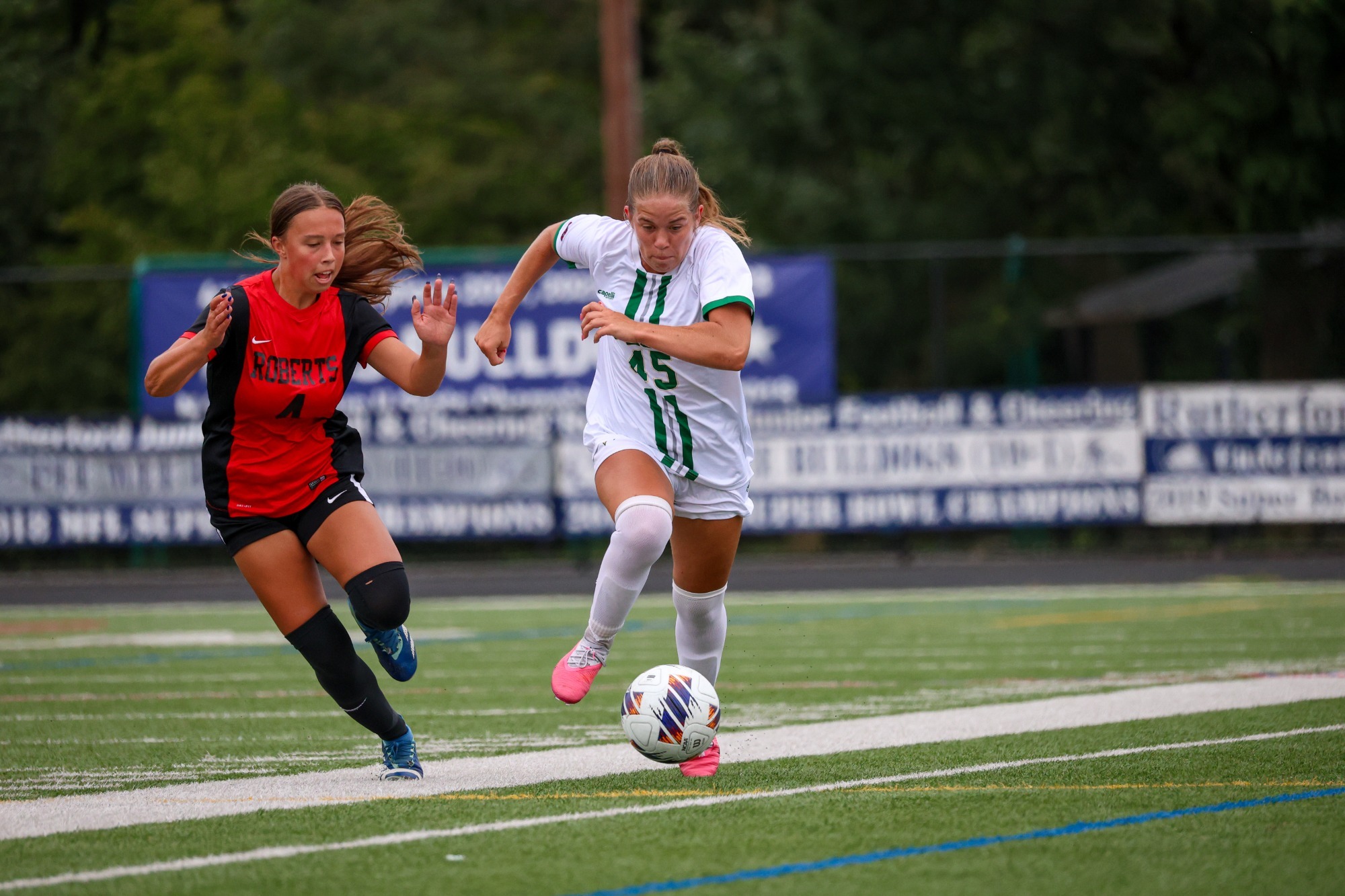 Brooklyn Niemy dribbling past defender