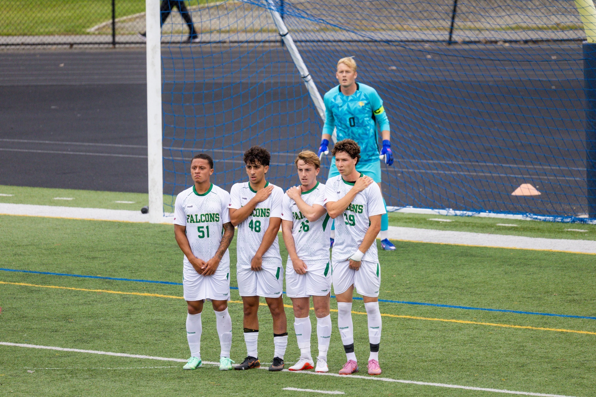 Felician players waiting for Caldwell Free Kick attempt.
