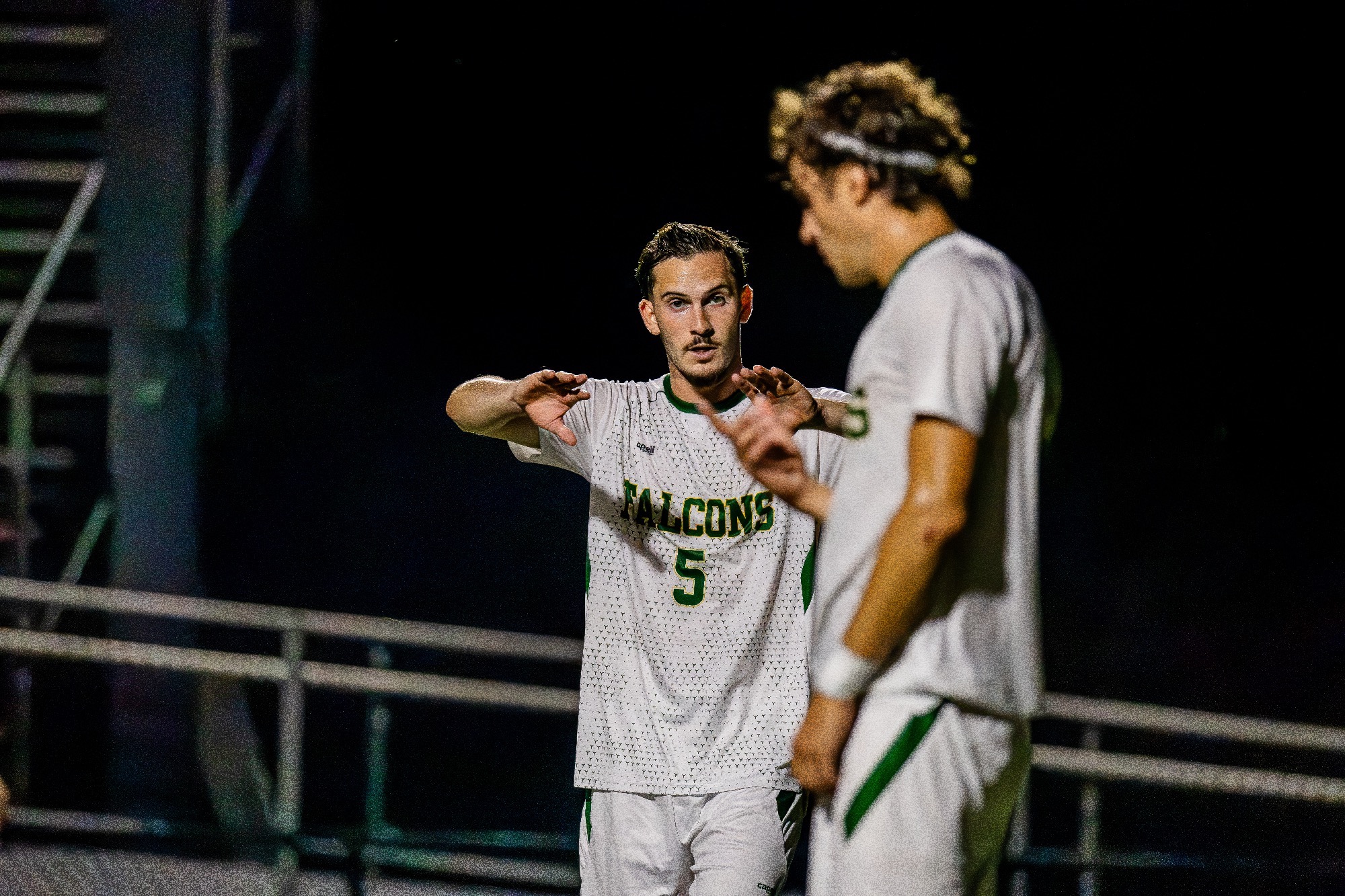 Guy Raish talking to teammate