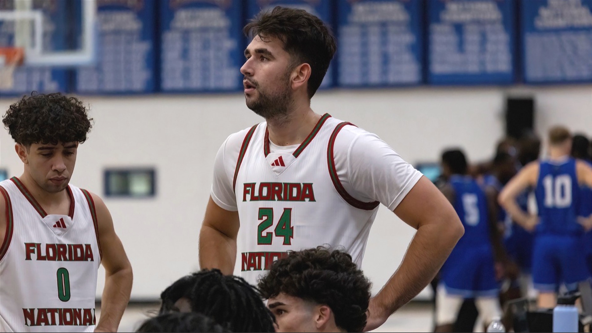 Jonathan Norman resetting and resting during a timeout against the University of the Virgin Islands 2025-26