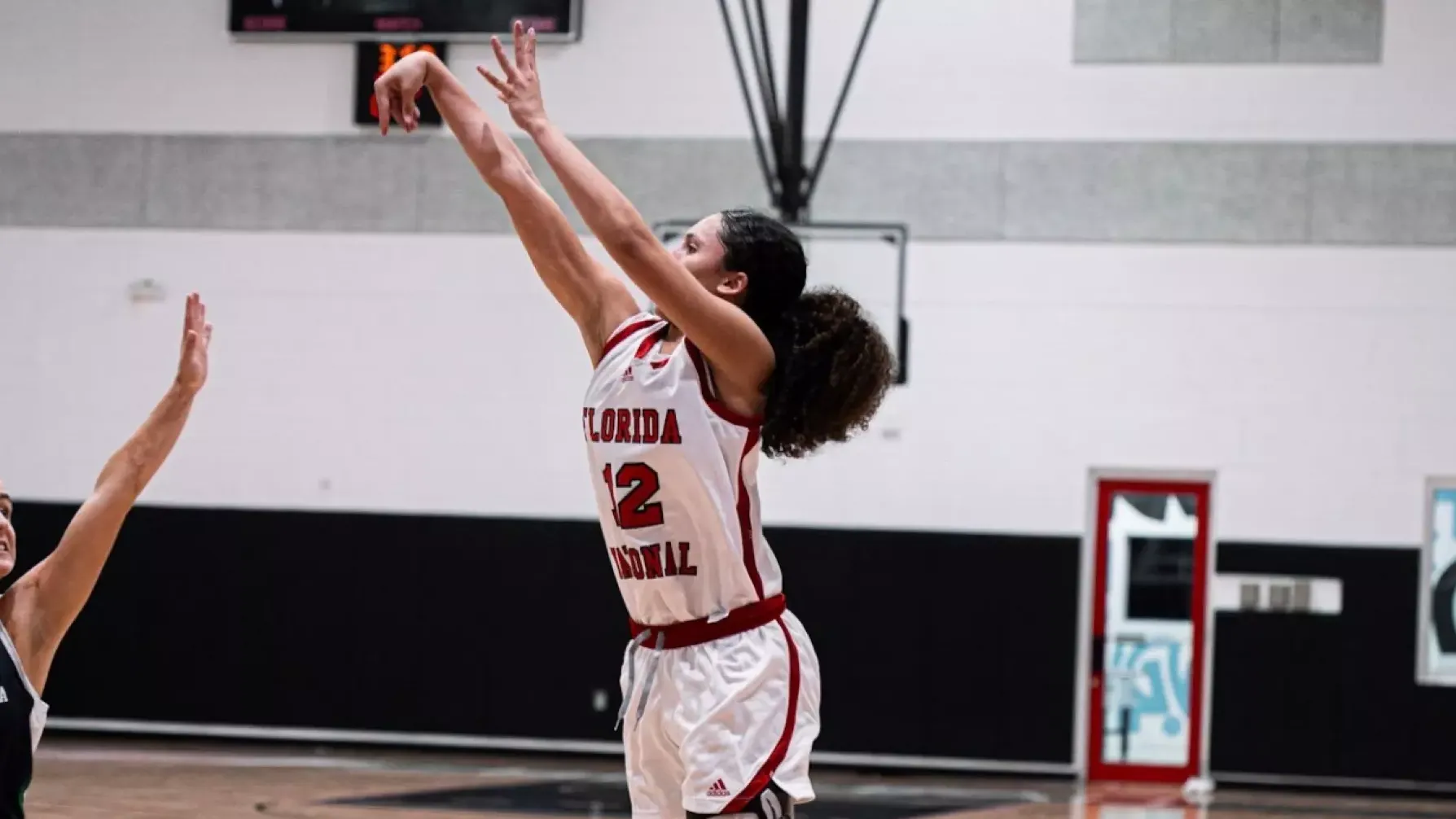 Ziul Gonzalez shooting a three against Ave Maria 2025-26