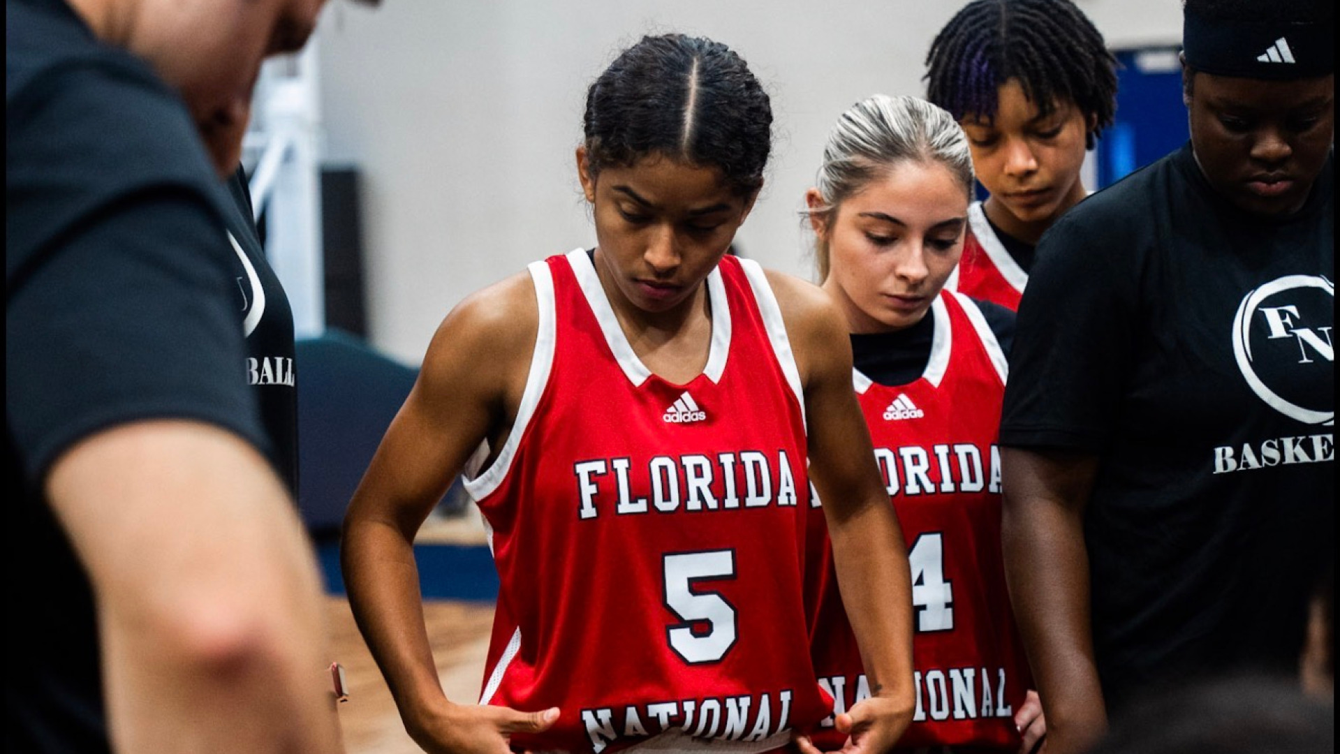 Jaylyn Laguna listening to a play call in a timeout against St. Thomas 2025-26