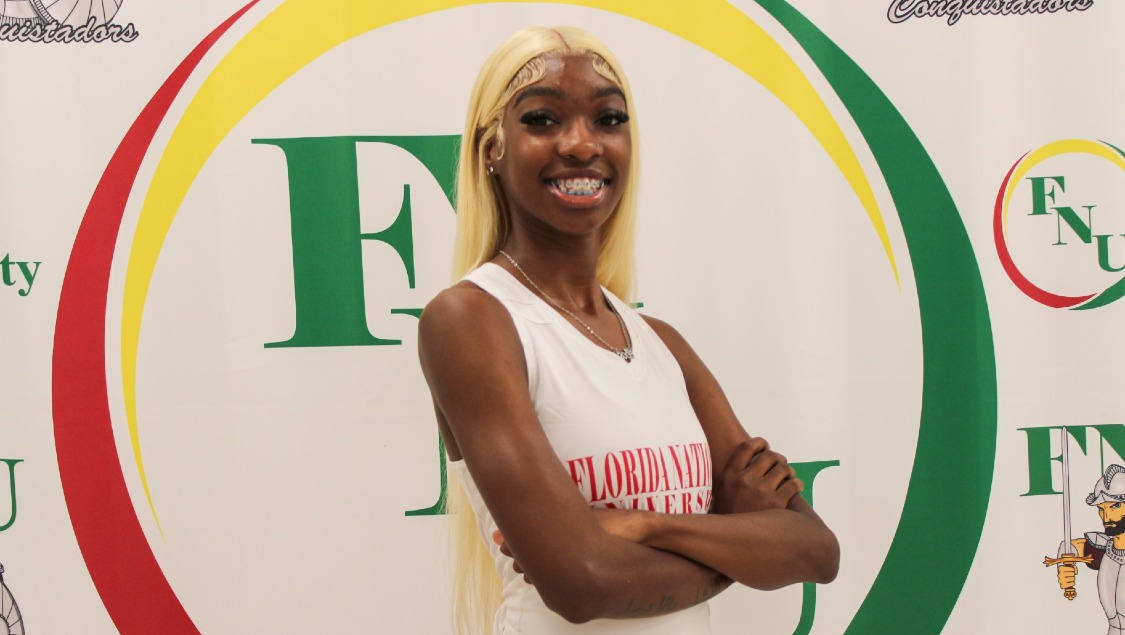 Khy Burdon in front of FNU logo