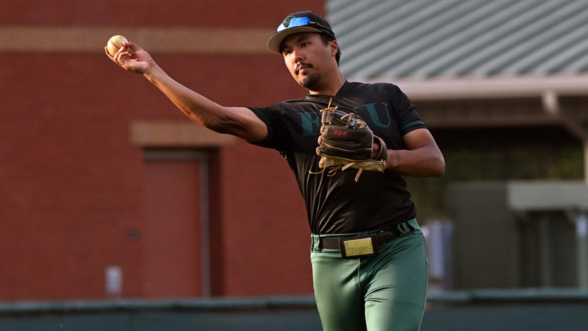 Christopher Rivera throwing the baseball at CAC Tournament 2025