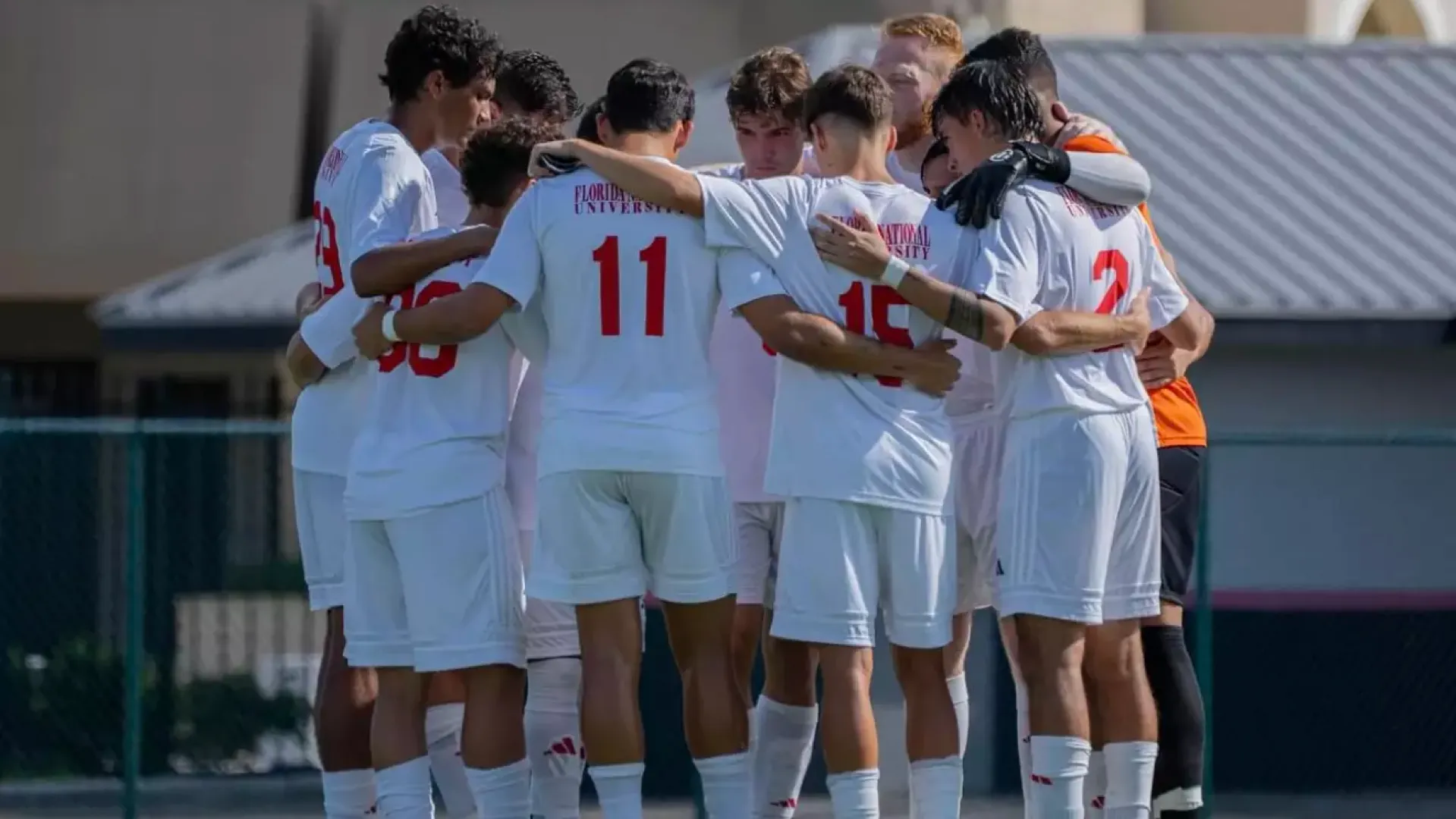 FNU men's soccer huddle before facing Ave Maria University 2025