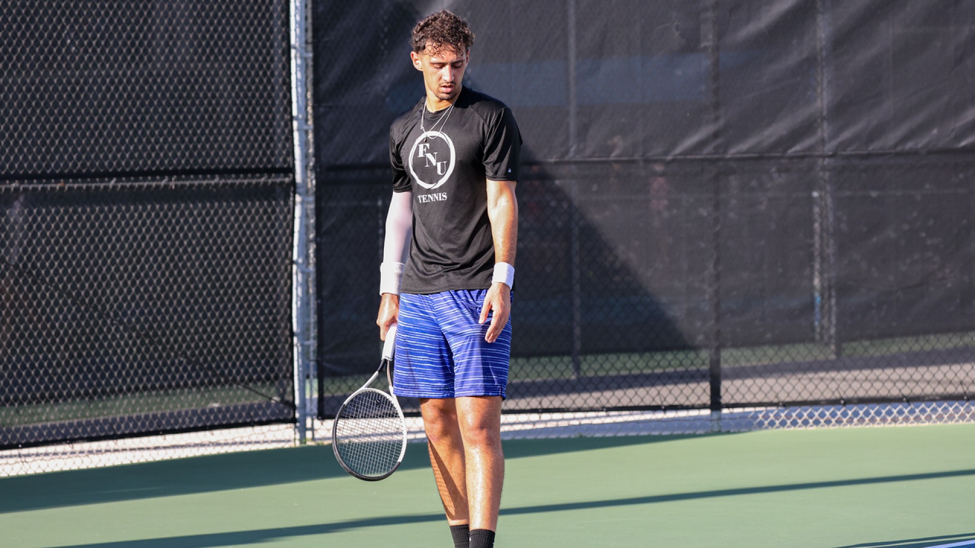 Anis Kerfah preparing a serve at the 2025 ITA NAIA Men's and Women's Florida Regional Championships