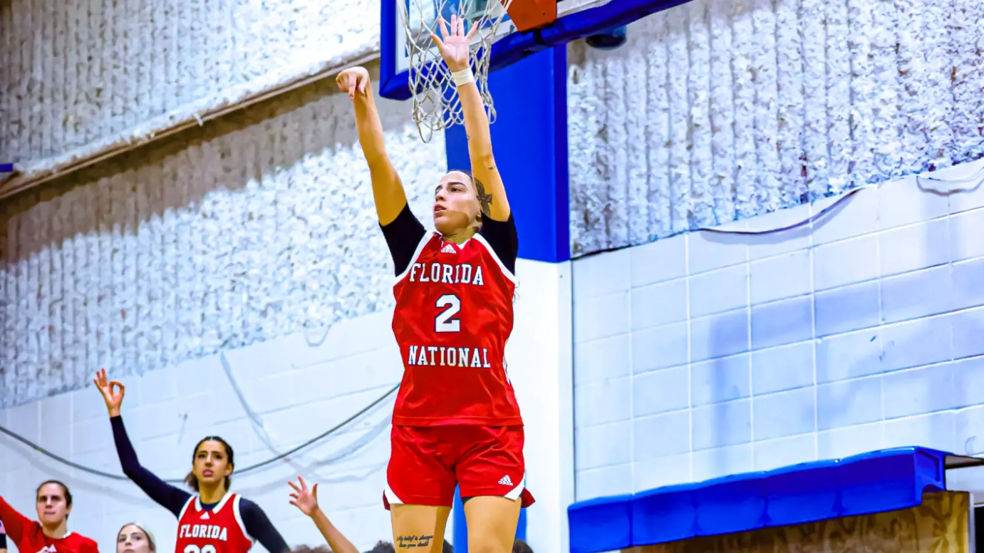 Kaylee Llanos shooting a three against Trinity College of Jacksonville 2025-26