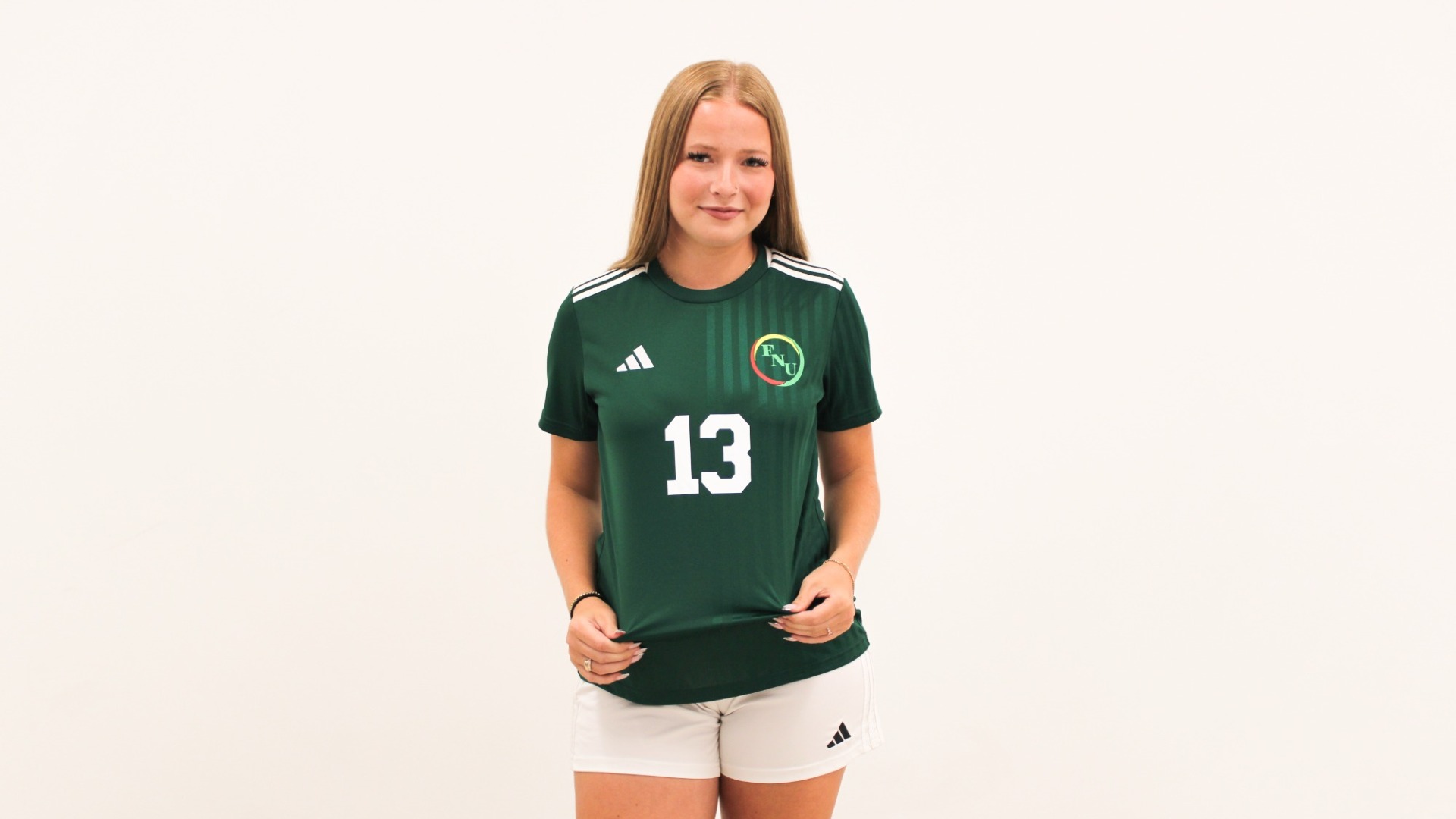 Mette Battling during media day 2026, holding jersey