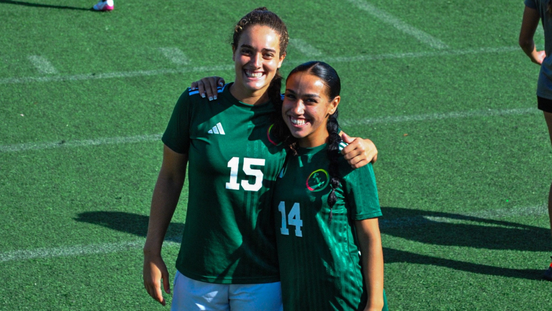 Luiza Ferreira and Mia Santana posing before home game against Florida College