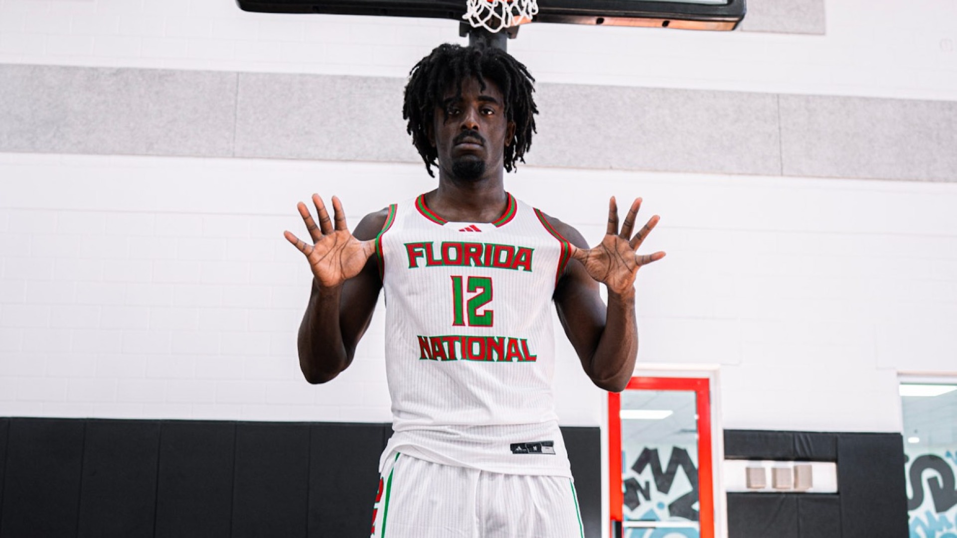 Trevon Clark during media day holding out jersey