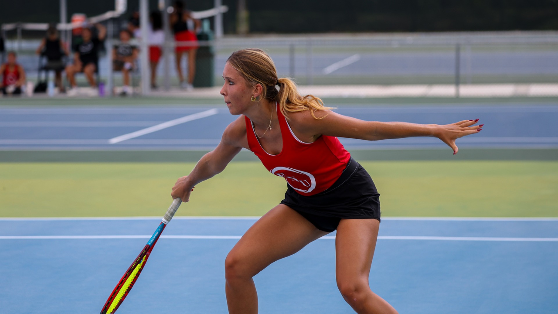 Julia Chodkowska preparing to hit a tennis ball at the YTF Southeastern Invitational