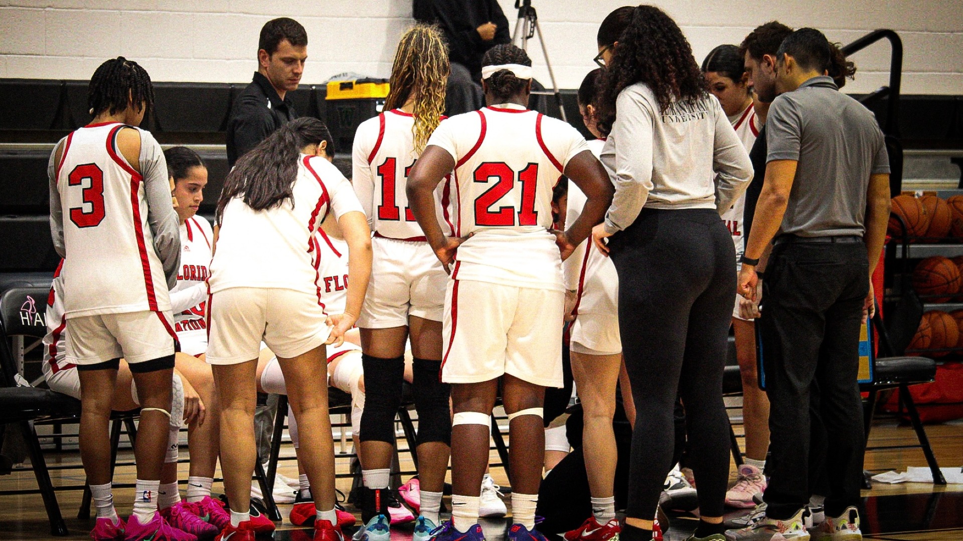 FNU women's basketball during a huddle against Warner University 2025-26