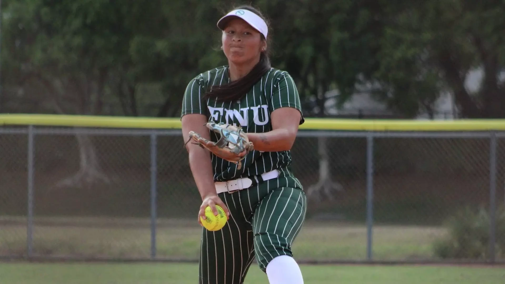 Brunella Beteta loading up to throw a pitch against Florida Memorial 2026
