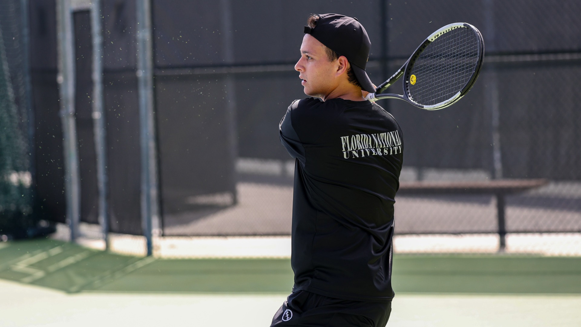 Alejandro Suarez hitting a tennis ball with a racket mid swing 2025-26