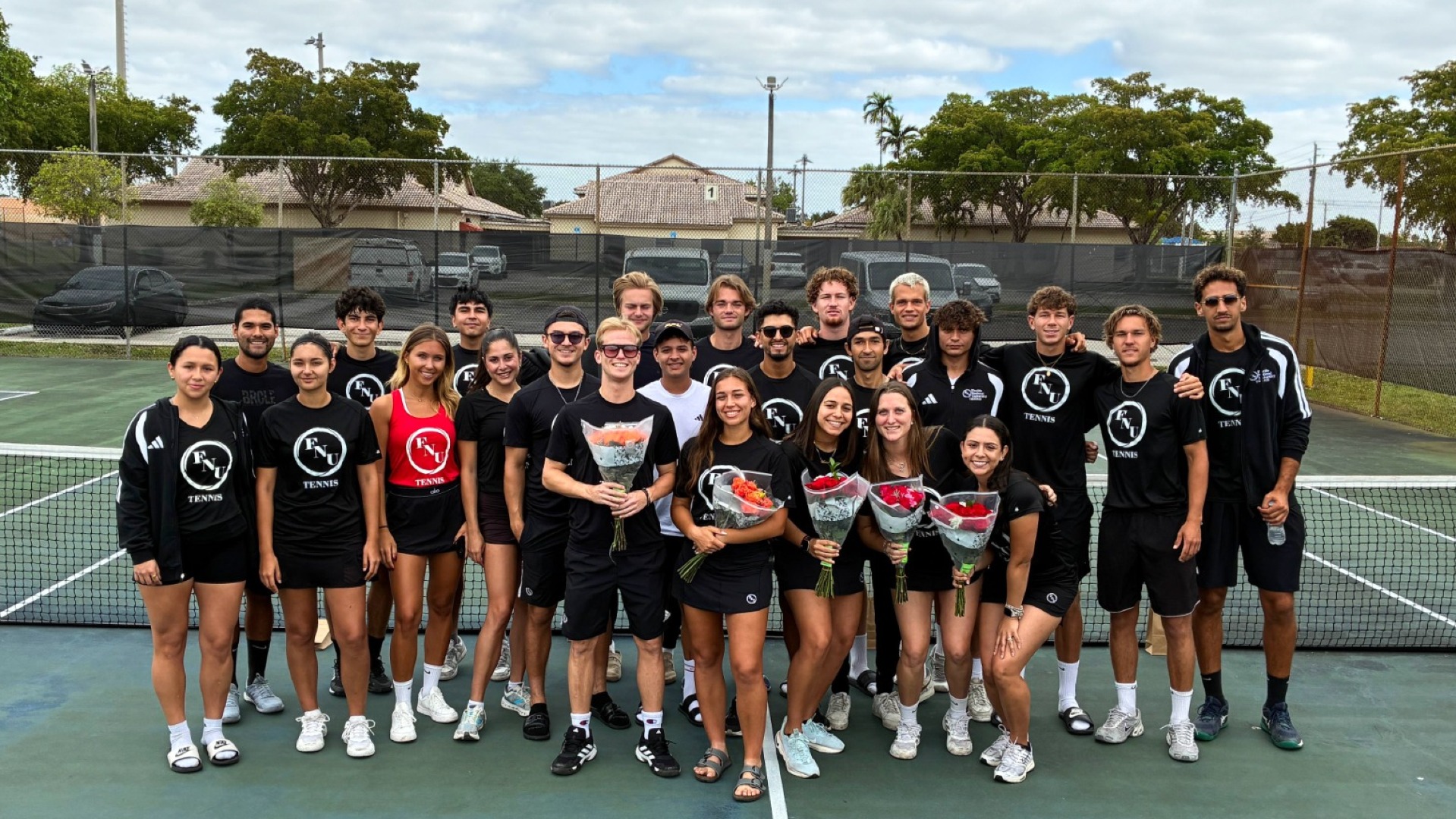 FNU tennis taking a group photo on senior day 2026
