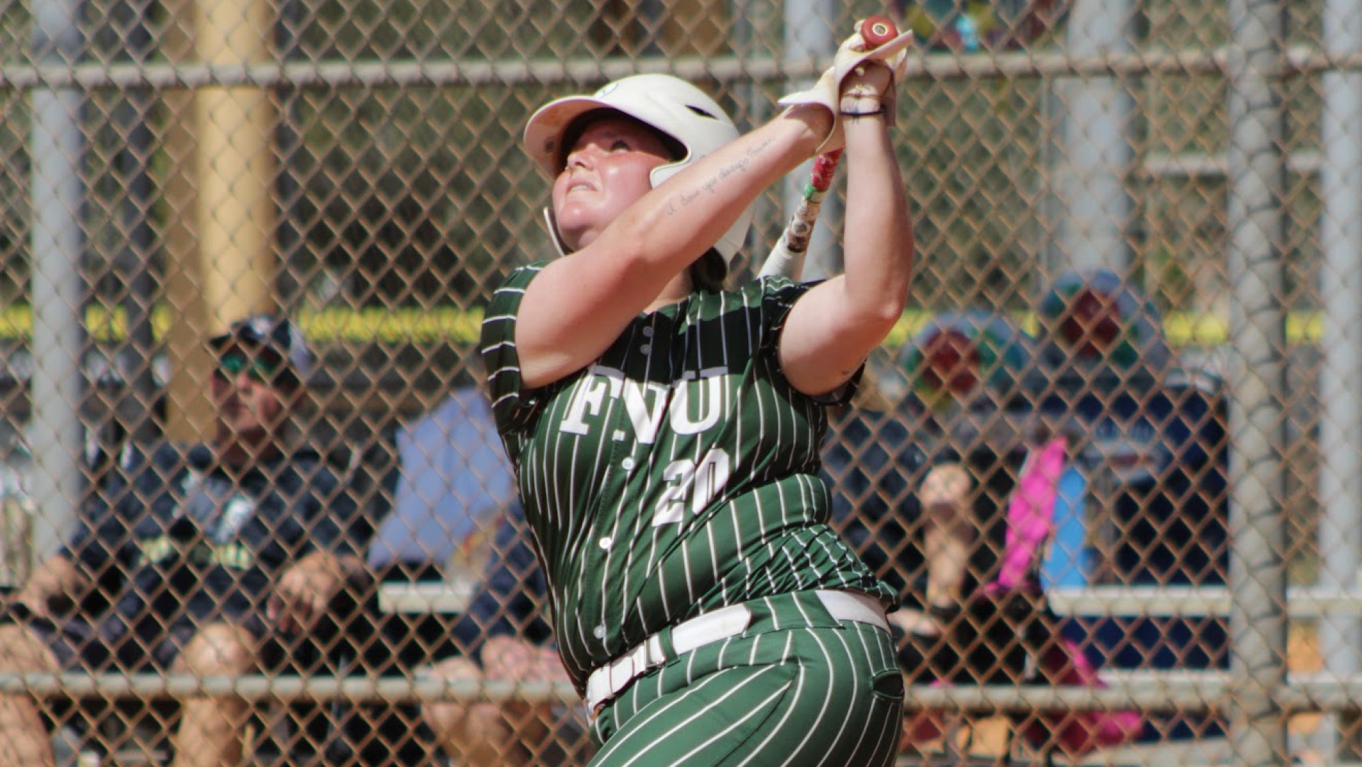 Sophia White hitting during FNU's home opener for the 2026 season