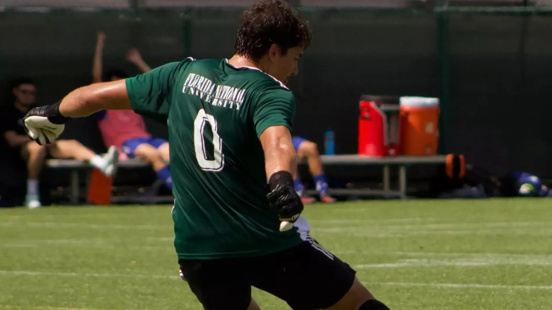 Ignacio Pacheco kicking a soccer ball in Florida National's home opener 2026.