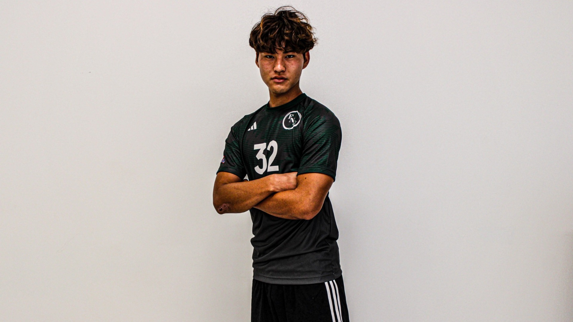 Yosuke Shimizu crossed arms during media day 2026