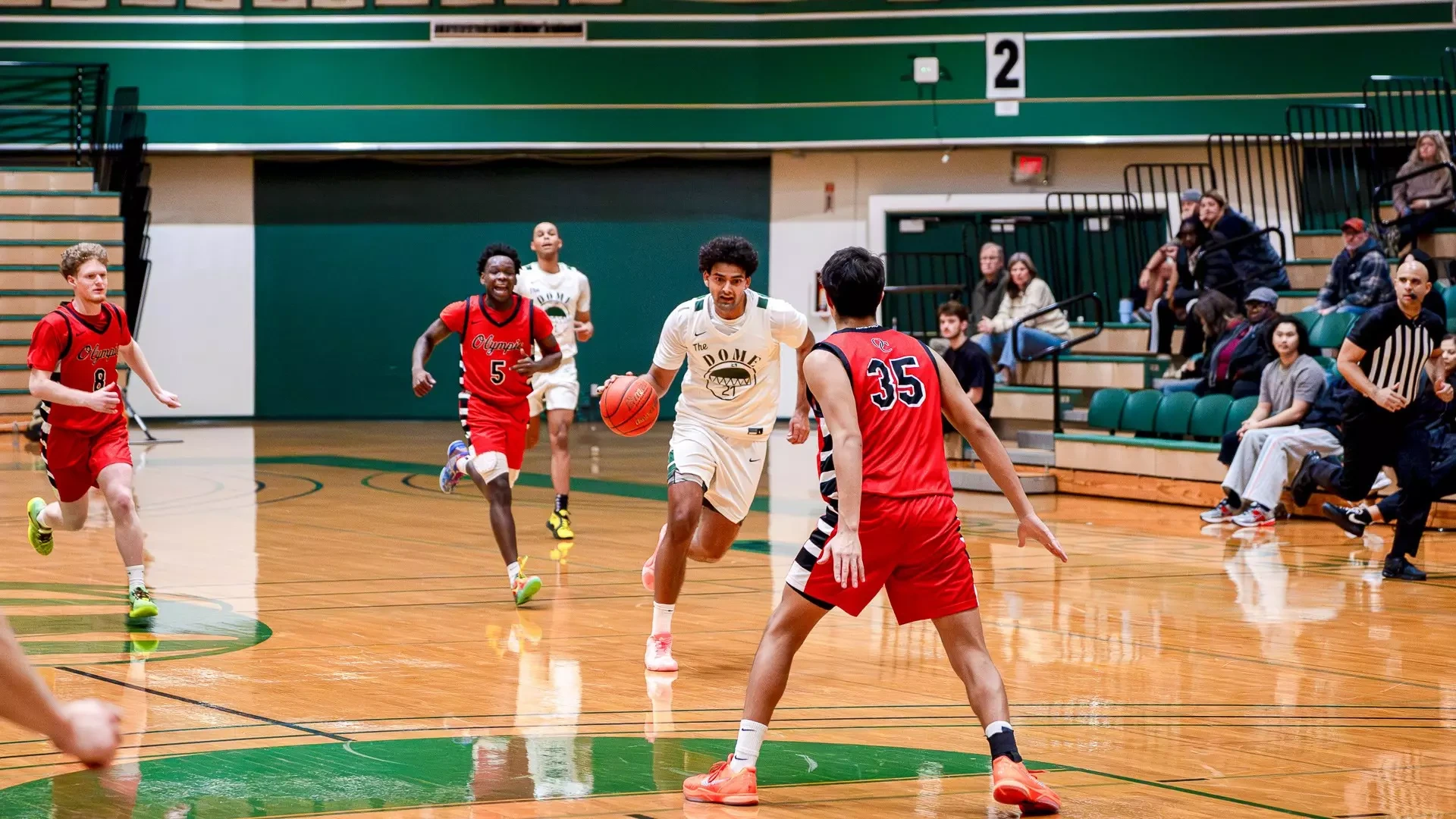 Prashant Chouhan advances the ball against Olympic College
