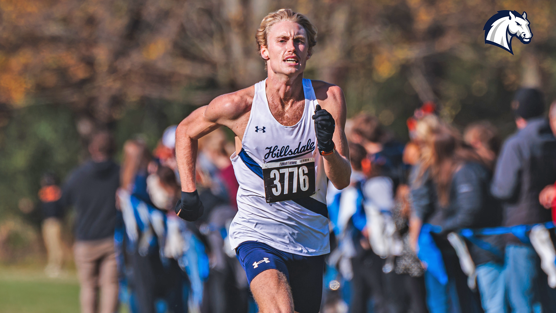 Hillsdale's Gabriel Phillips races down the home stretch at the 2025 G-MAC Championships in Midland, Michigan.