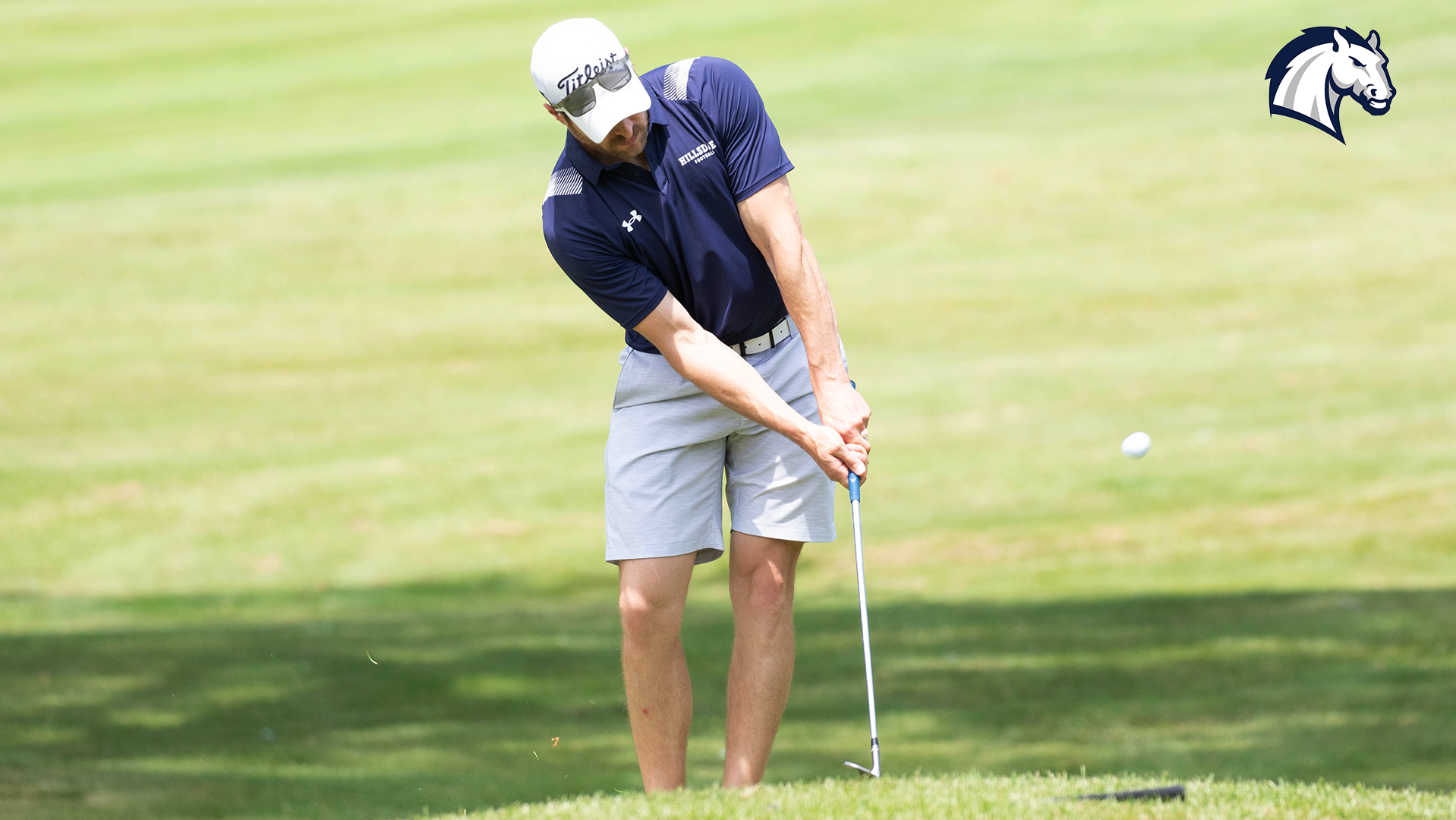 A golfer hits a chip shot during the 2025 Hillsdale College Football Golf Outing in June. 