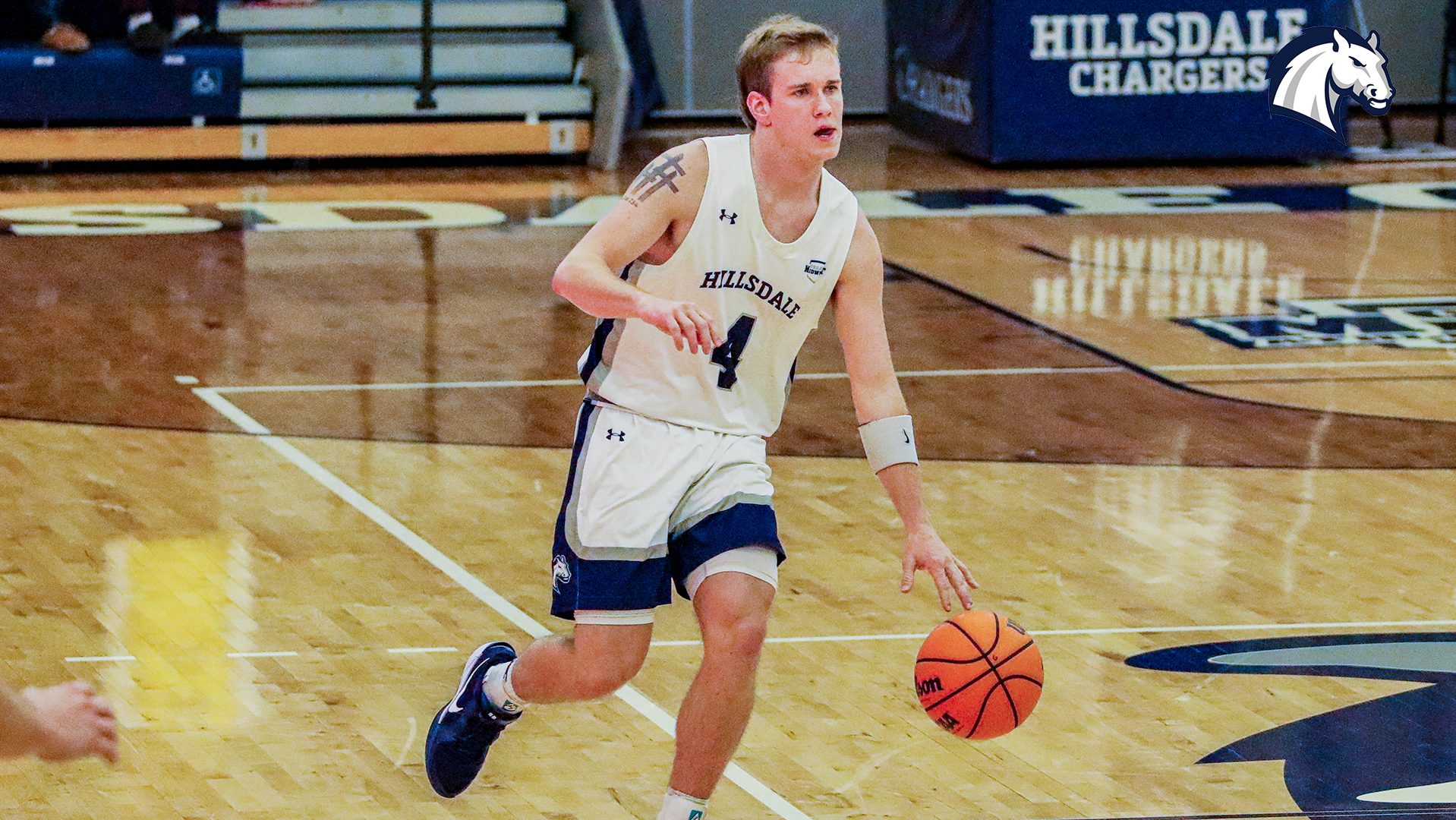 Hillsdale's Paxton Giertz brings the ball up the court against Andrews on Nov. 19, 2025.