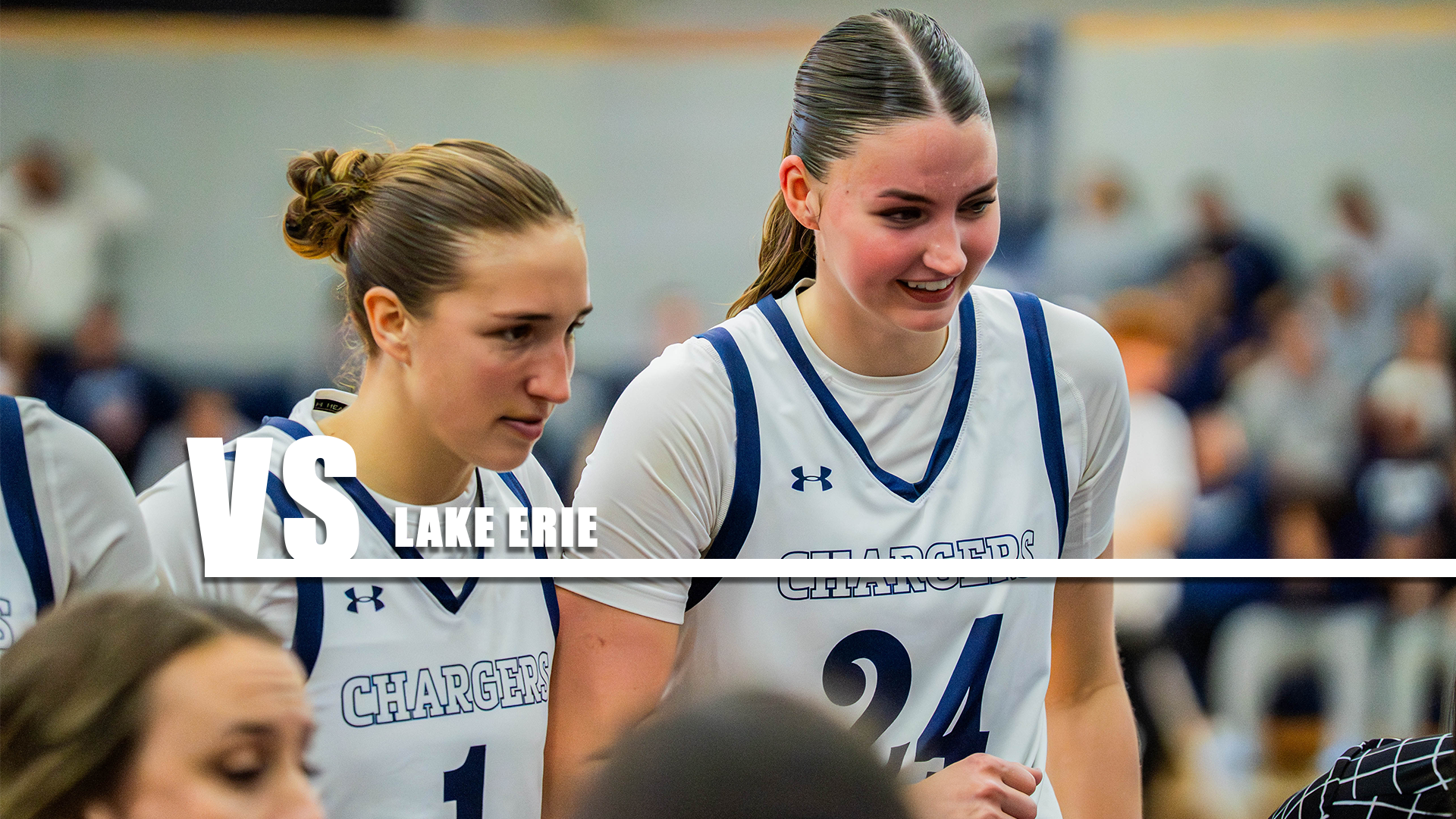 Hillsdake's Payton Adkins (left) and Ellie Bruce listen in during a timeout against Illinois-Springfield on Nov. 14, 2025.