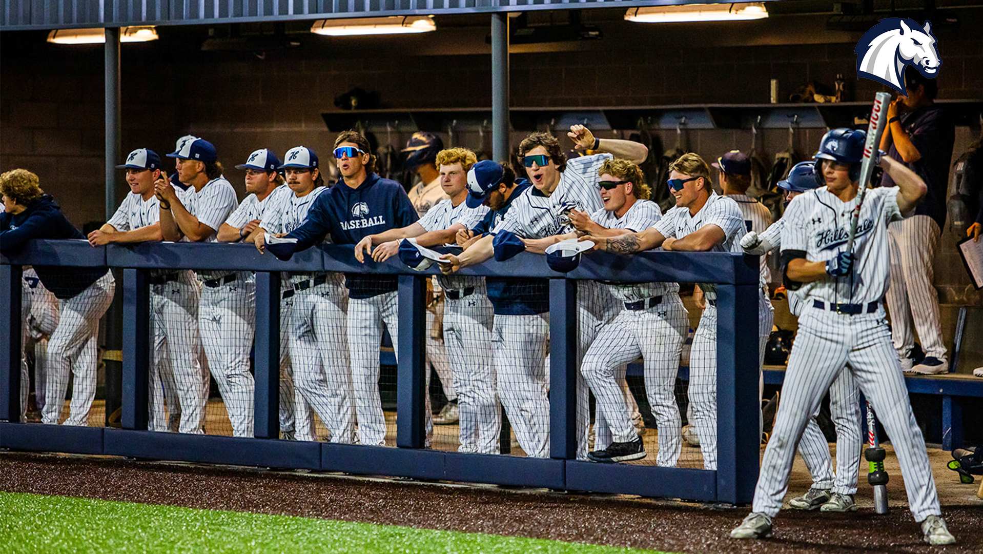 Hillsdale's baseball team watches the action from the dugout in a contest against Ashland in 2025.